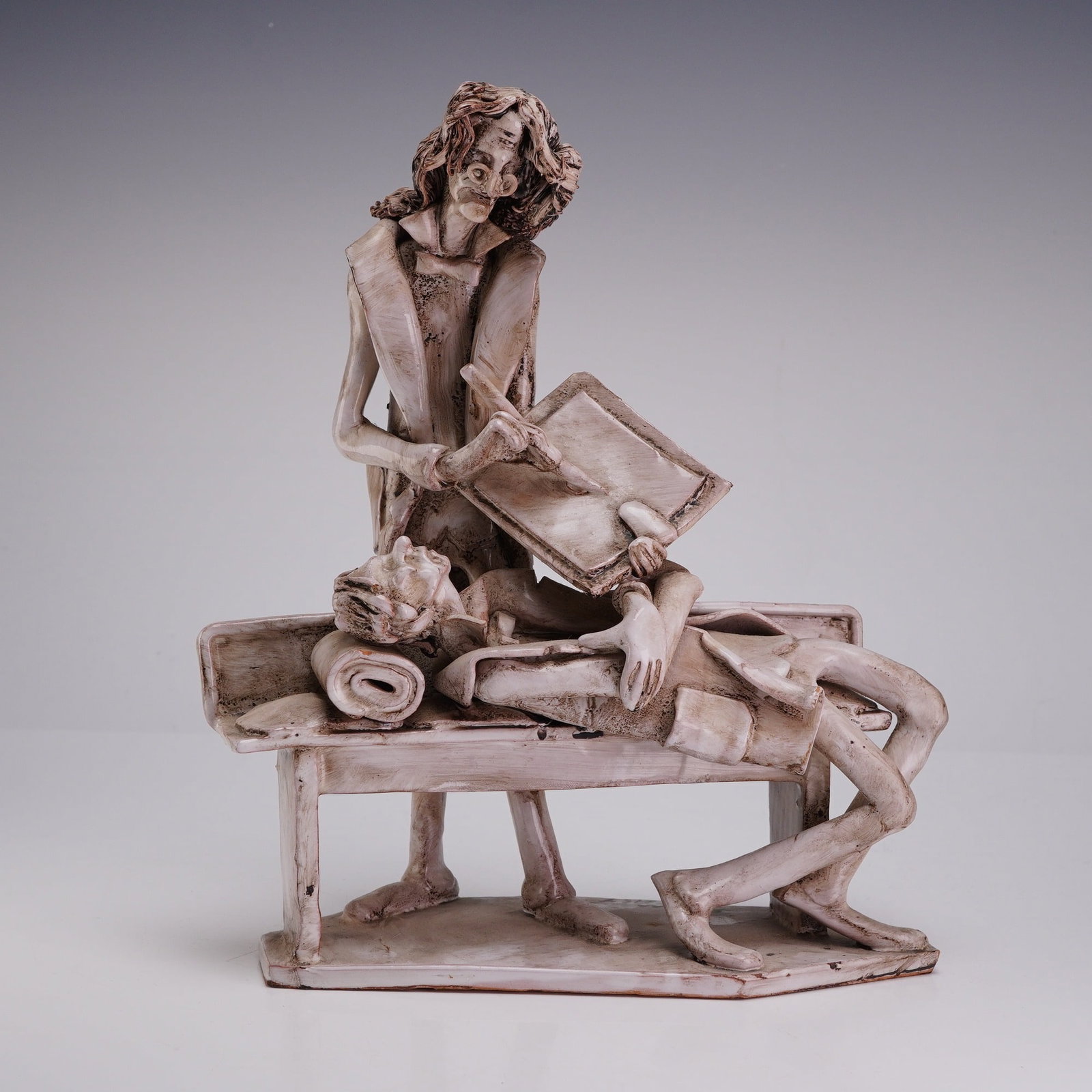 Dino Bencini Italian Glazed Ceramic Psychiatrist & Patient Sculpture: This glazed ceramic sculpture is the work of Italian artist Dino Bencini. The piece depicts a psychiatrist and a patient in an expressionistic caricature style. The standing psychiatrist figure is ren