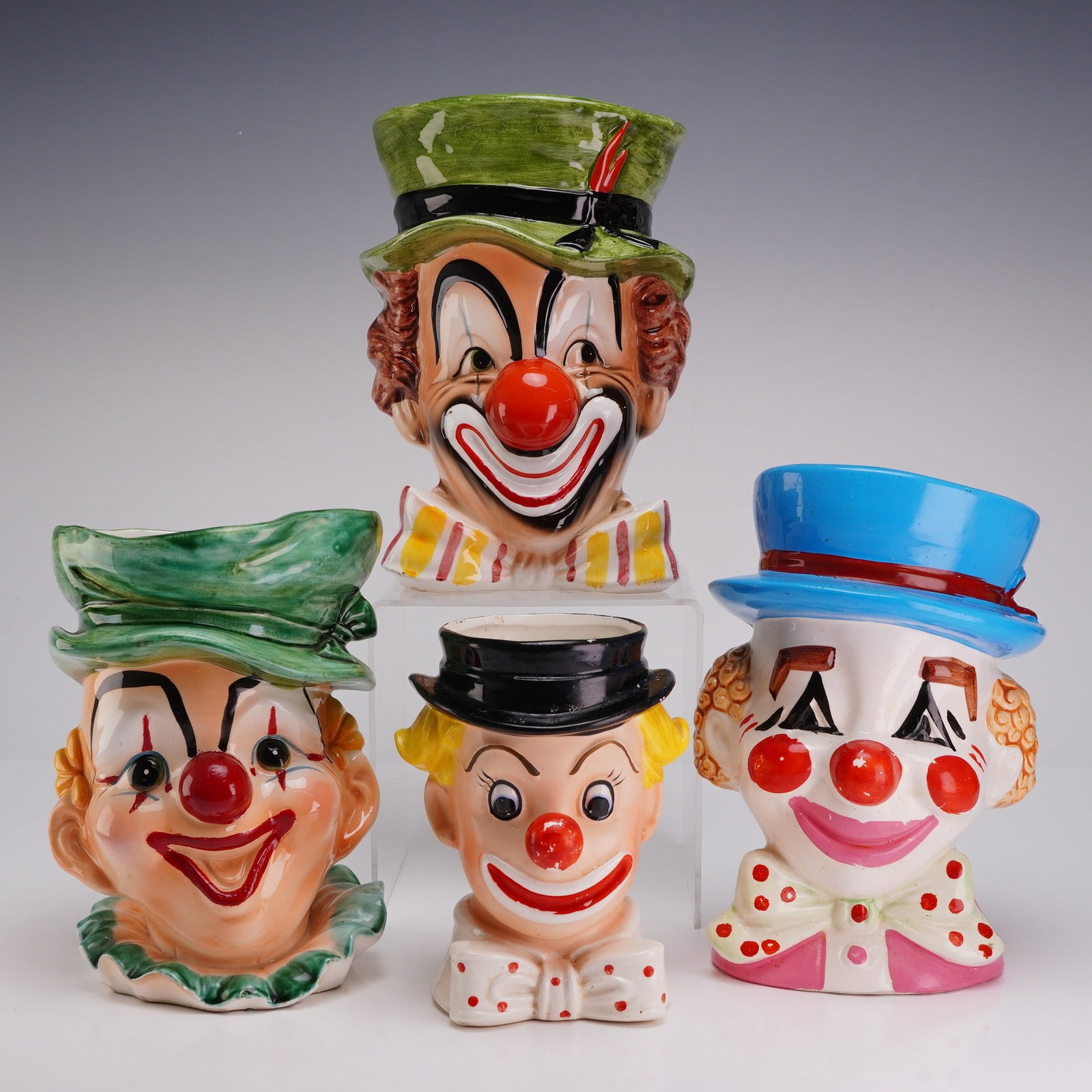 4pc Mid-Century Made in Japan Clown Heads Ceramic Vases & Planters: This collection contains four clown heads including various mid-century ceramic head vases and planters produced by Japanese exporters for the American market. The group features a Relpo head vase, mo