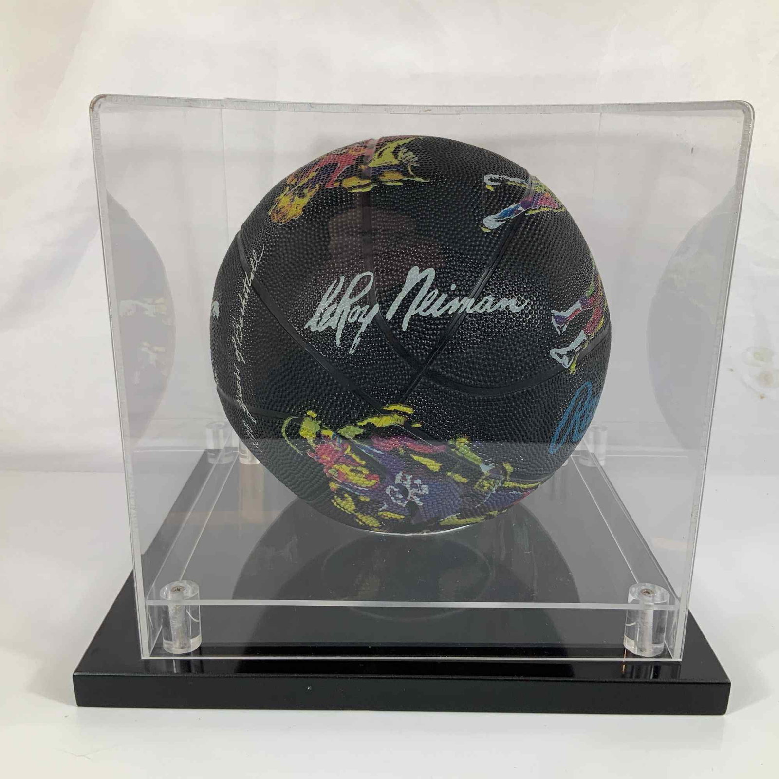 Rawlings LeRoy Neiman Commemorative Edition NCAA 100 Years of Basketball Signed Basketball: This Rawlings basketball is a Commemorative Edition produced for the 100 Years of NCAA Basketball, featuring original illustrations by American artist LeRoy Neiman. The black basketball serves as a ca