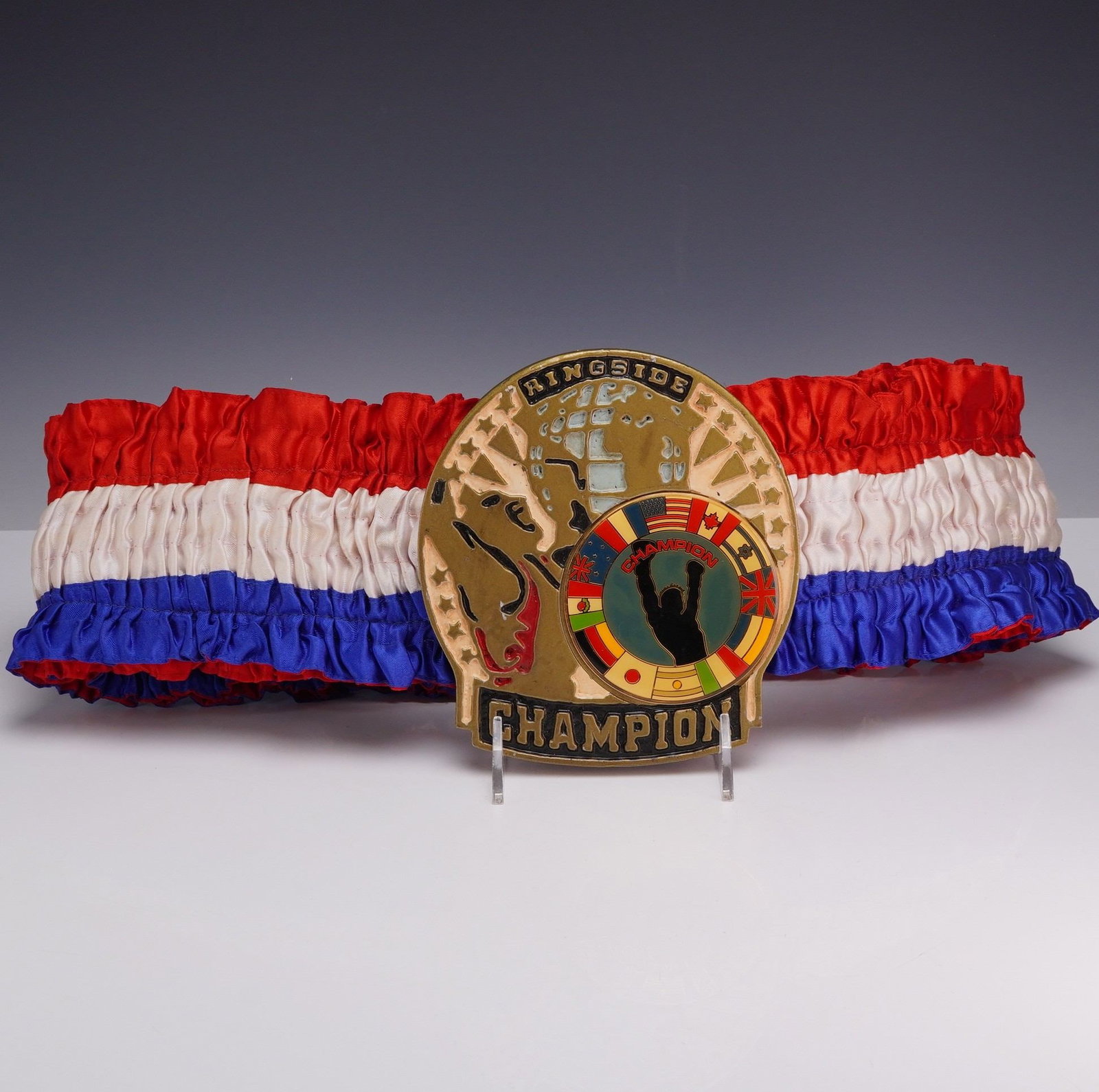Ringside Boxing Championship Belt Signed by T. Dumont: This contemporary boxing championship belt is manufactured by Ringside and is identified through market research as the Economy model. The belt features a large, gold-tone metal center plate mounted o