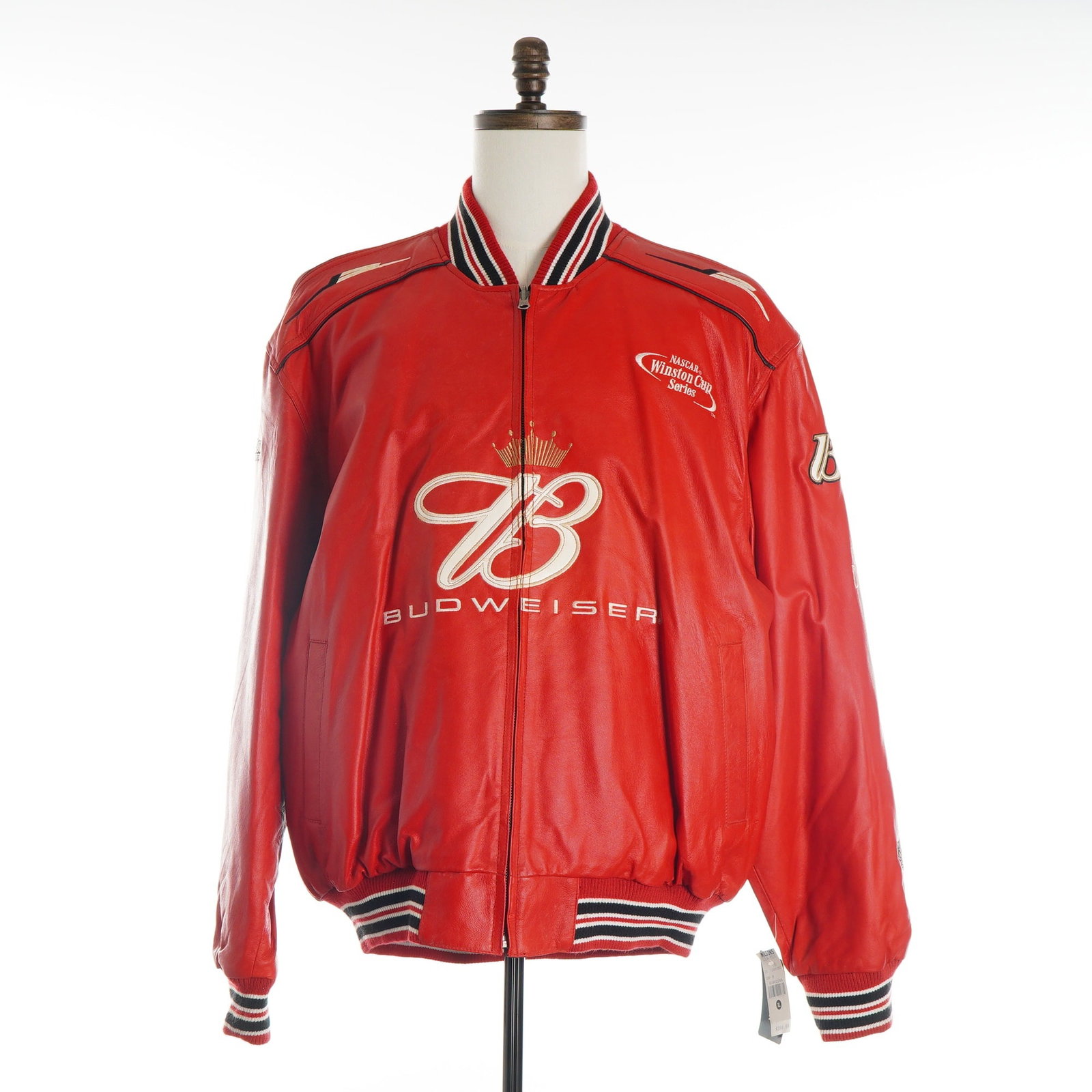 Dale Earnhardt Jr. Budweiser NASCAR Winston Cup Series Leather Racing Jacket, Size XL: A red leather NASCAR racing jacket manufactured by Chase Authentics for Wilsons Leather, commemorating driver Dale Earnhardt Jr. during the Winston Cup Series era. The garment features a bomber-style 