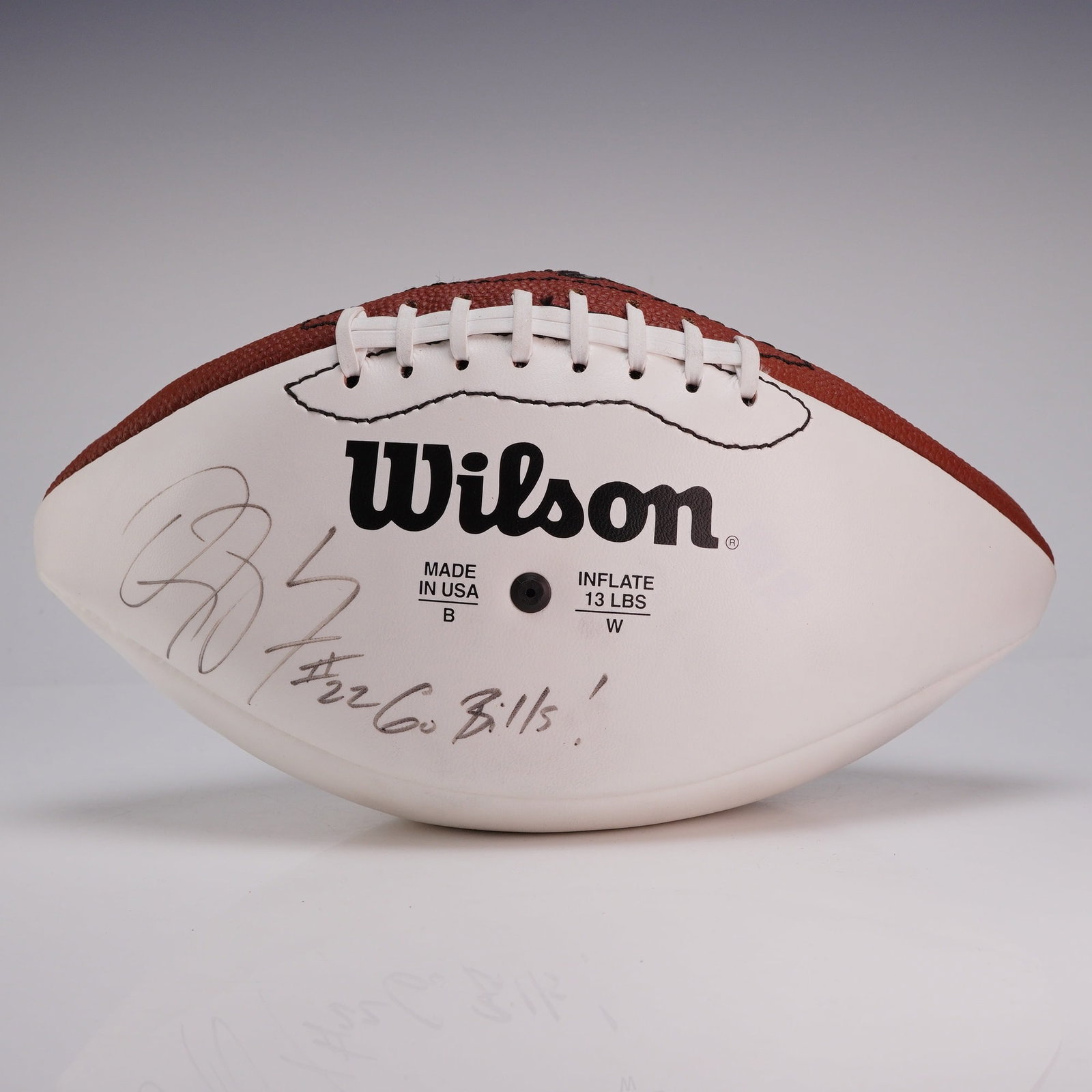 Wilson NFL Buffalo Bills Fred Jackson #22 Signed Ball: This Wilson brand souvenir NFL football is designed for autograph collection, featuring two white synthetic leather panels and two brown pebble-grain panels. The ball is an officially licensed product