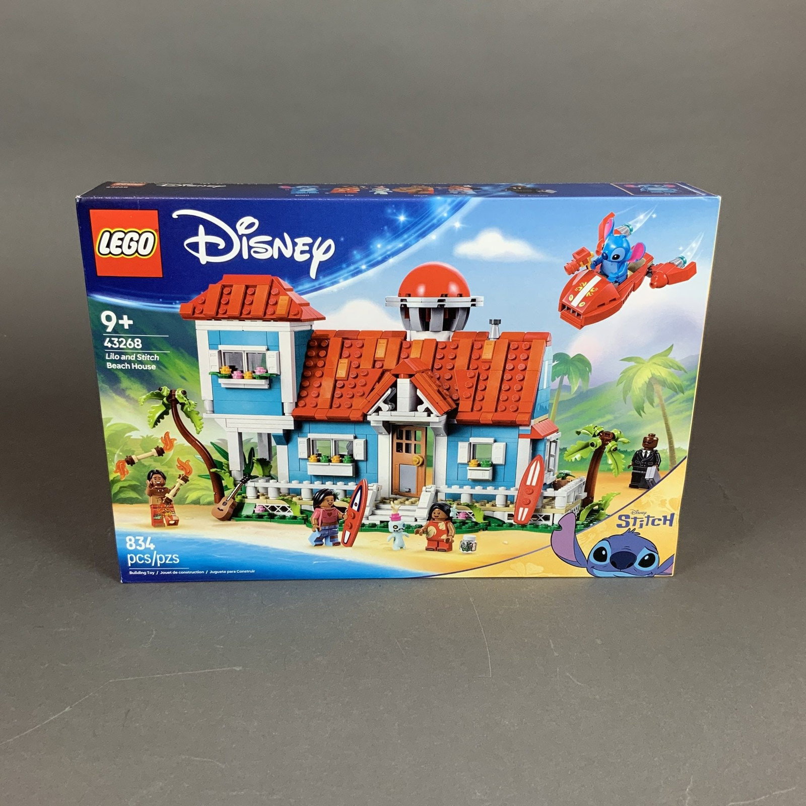 LEGO Disney Lilo and Stitch Beach House Set: This is a factory-sealed LEGO Disney building set, number 43268, titled Lilo and Stitch Beach House. The set belongs to the Disney Stitch series and contains 834 plastic pieces. The primary build is a