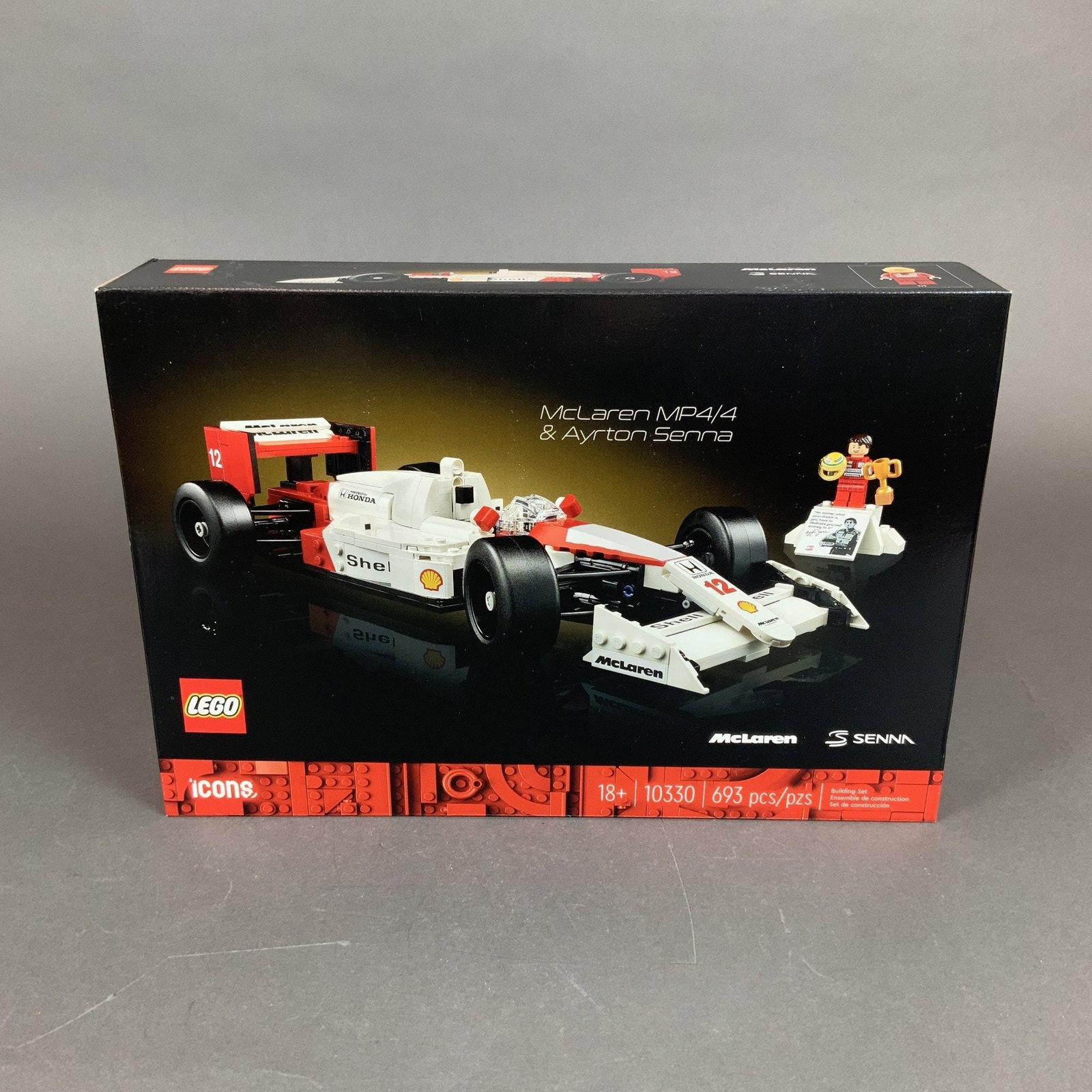 LEGO Icons McLaren MP4/4 and Ayrton Senna Building Set: This LEGO Icons building set, model 10330, features the McLaren MP4/4 and Ayrton Senna. Produced by The LEGO Group, the set consists of 693 plastic pieces designed for builders aged 18 and over. The
