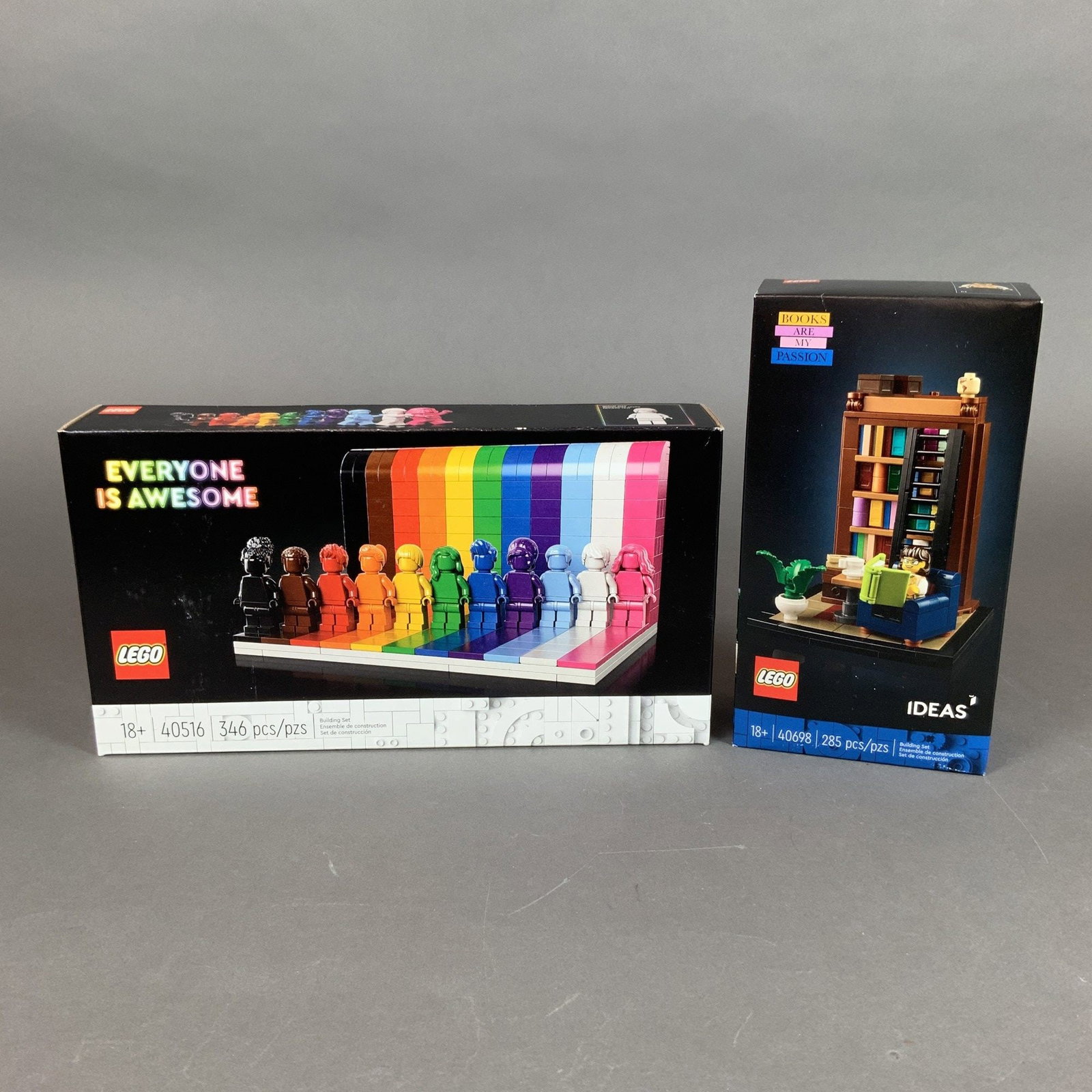 Two LEGO Building Sets, Everyone is Awesome 40516 and Books Are My Passion 40698: This lot consists of two LEGO construction sets in their original retail packaging. The first item is the Everyone is Awesome set, identification number 40516, which contains 346 pieces. This model fe