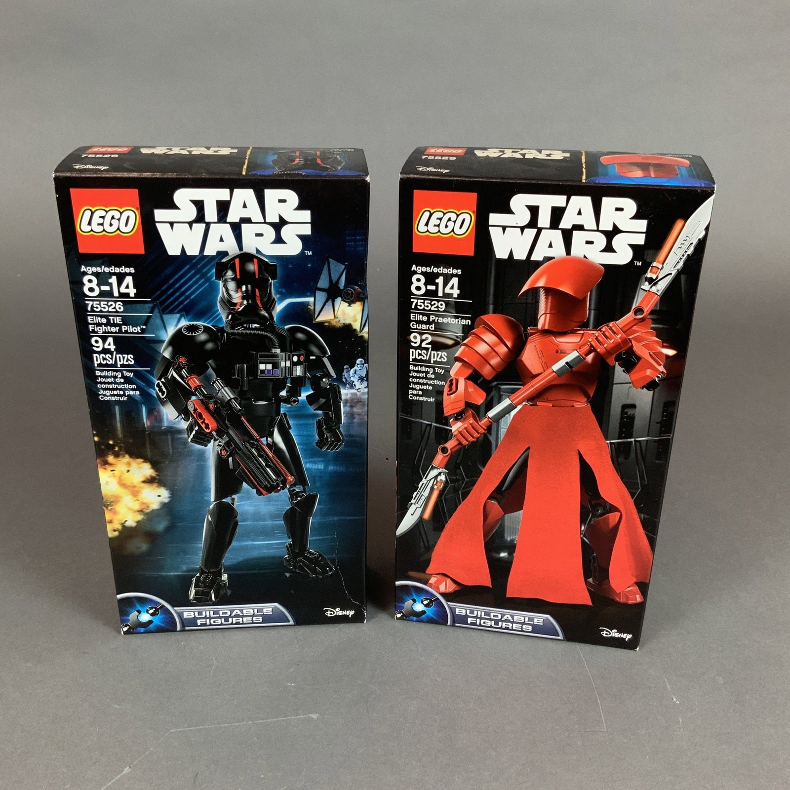 Two LEGO Star Wars Buildable Figures Sets 75526 and 75529: This lot features two original LEGO Star Wars Buildable Figures sets in their original packaging. The first set is the Elite Praetorian Guard, model 75529, which includes 92 pieces to assemble a