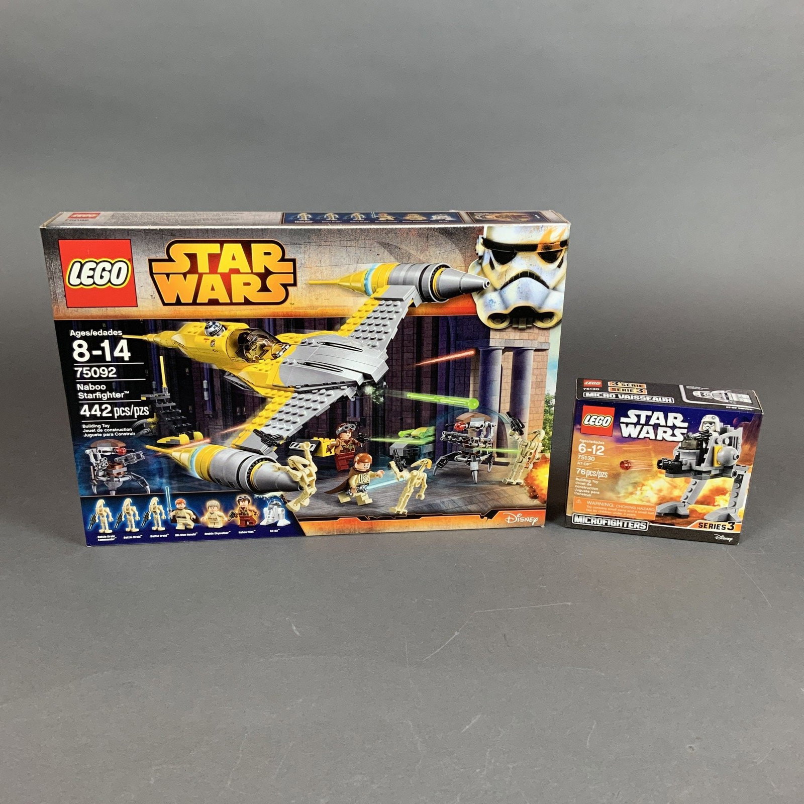 Two LEGO Star Wars Building Toy Sets Models 75092 and 75130: This lot comprises two original LEGO Star Wars construction sets in their factory retail packaging. The first set is the Naboo Starfighter, model number 75092, which contains 442 pieces. The box art d