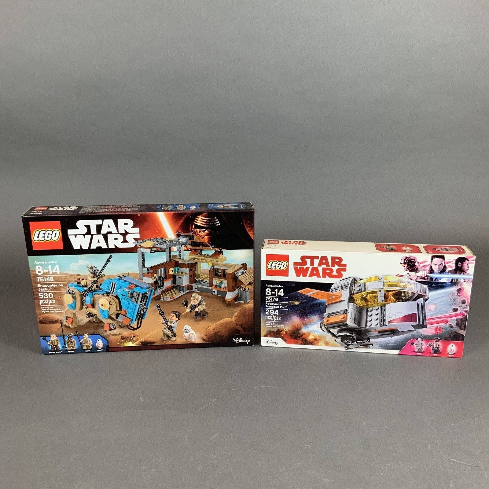 Two LEGO Star Wars Construction Sets 75176 and 75148: This lot features two LEGO Star Wars construction sets, both contained within their original retail packaging. The first set is the Resistance Transport Pod, set number 75176, which contains 294 piece
