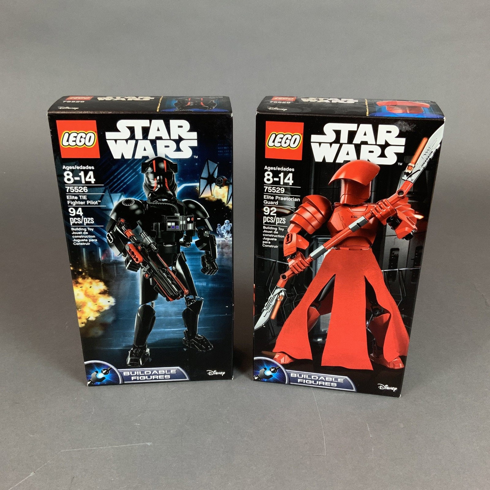2pc LEGO Star Wars Buildable Figures Sets 75526 and 75529: This lot consists of two LEGO Star Wars Buildable Figures sets in their original retail packaging. These large-scale, poseable action figures are constructed primarily from plastic elements. The