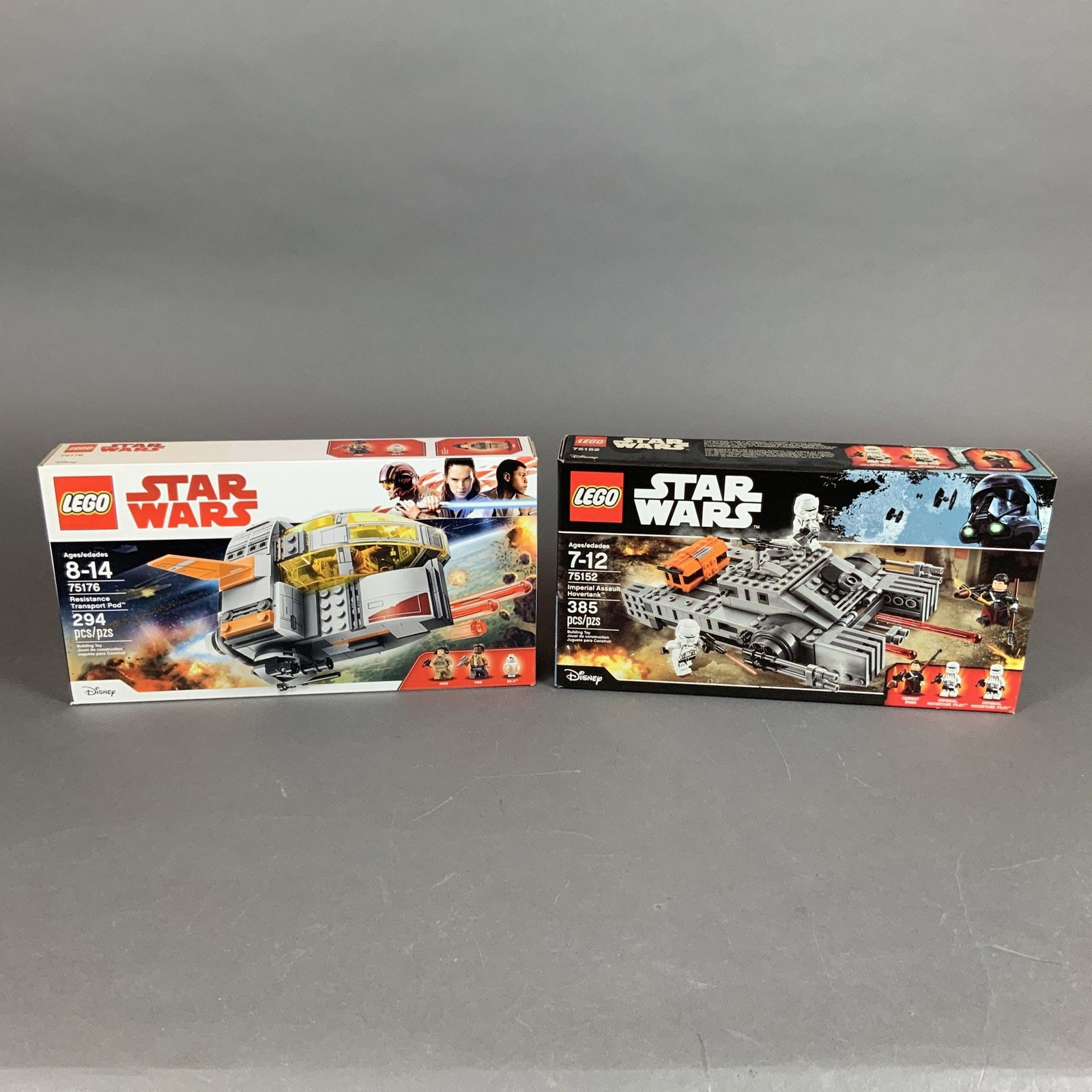 2pc LEGO Star Wars Building Sets, Imperial Assault Hovertank 75152 and Resistance Transport Pod: This lot comprises two original LEGO Star Wars building sets in their respective retail boxes. The first set is the Imperial Assault Hovertank, set number 75152, based on the film Rogue One: A Star Wa