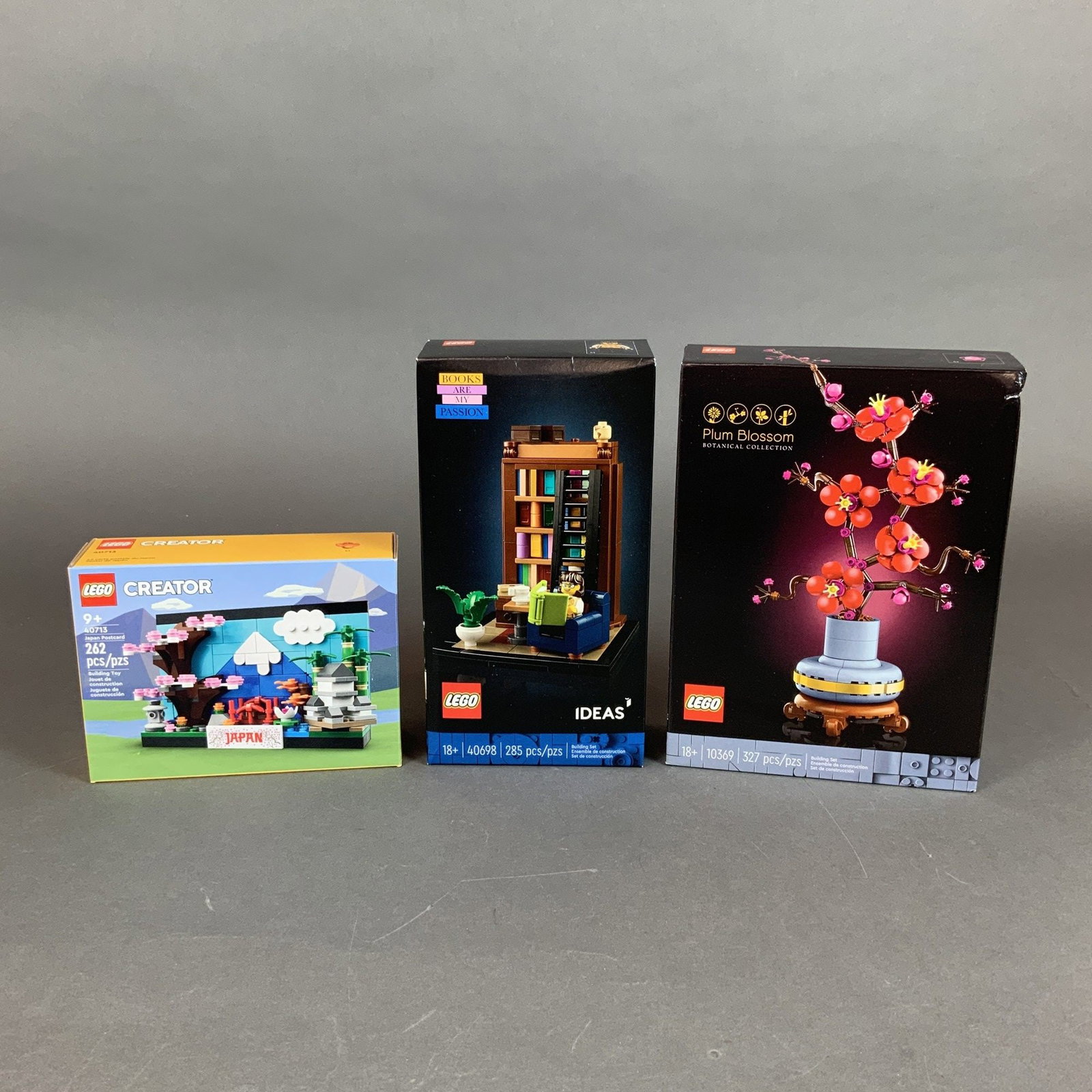 Three LEGO Construction Sets 40713 40698 and 10369: This lot features three original LEGO construction sets, each in its original factory packaging. The sets are constructed from molded plastic components. The first item is a LEGO Botanical Collection 