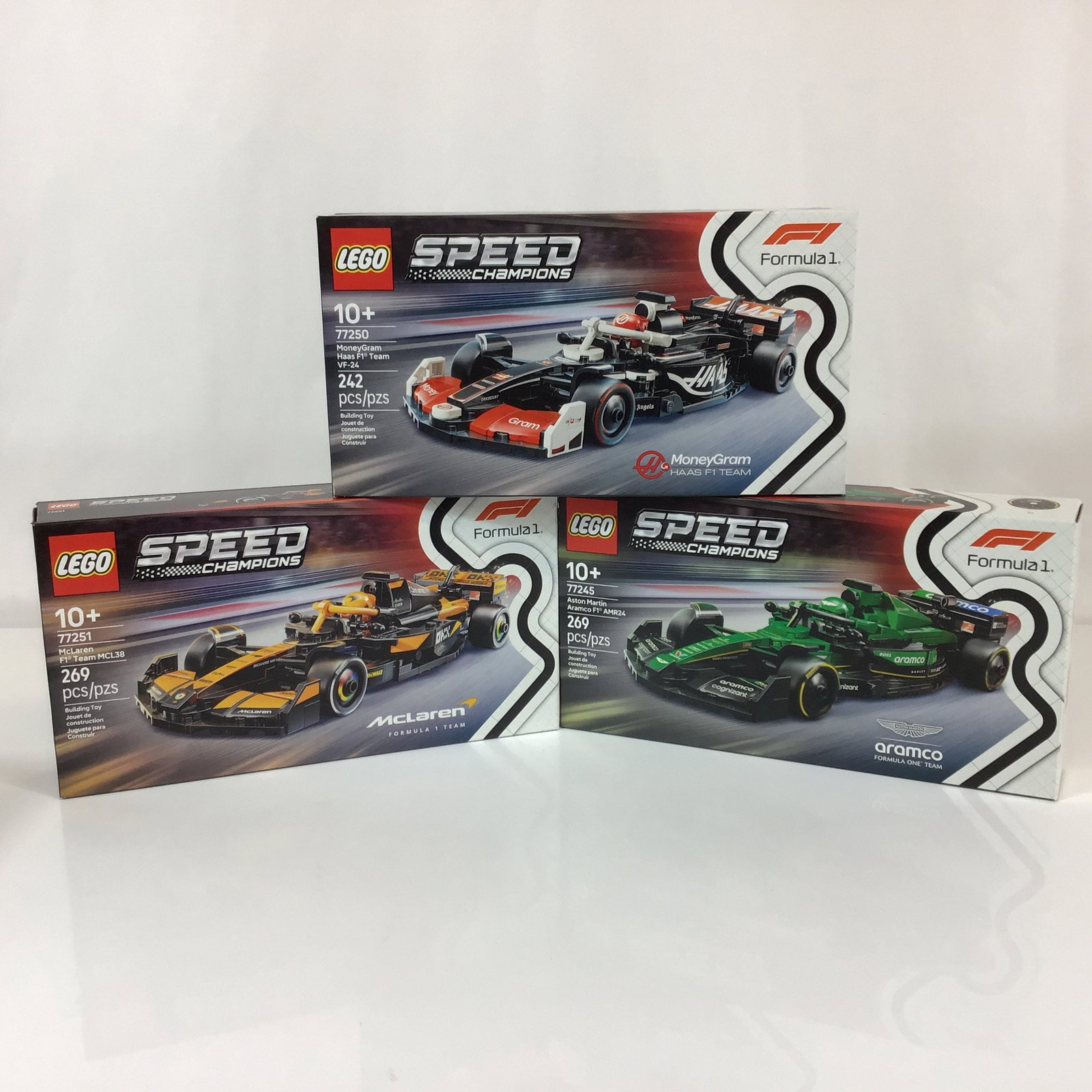 3pc LEGO Speed Champions Formula 1 Racing Car Building Sets: A trio of unopened LEGO Speed Champions Formula 1 racing car construction sets manufactured by the LEGO Group. Each set features a detailed model of a contemporary F1 race car with authentic team live