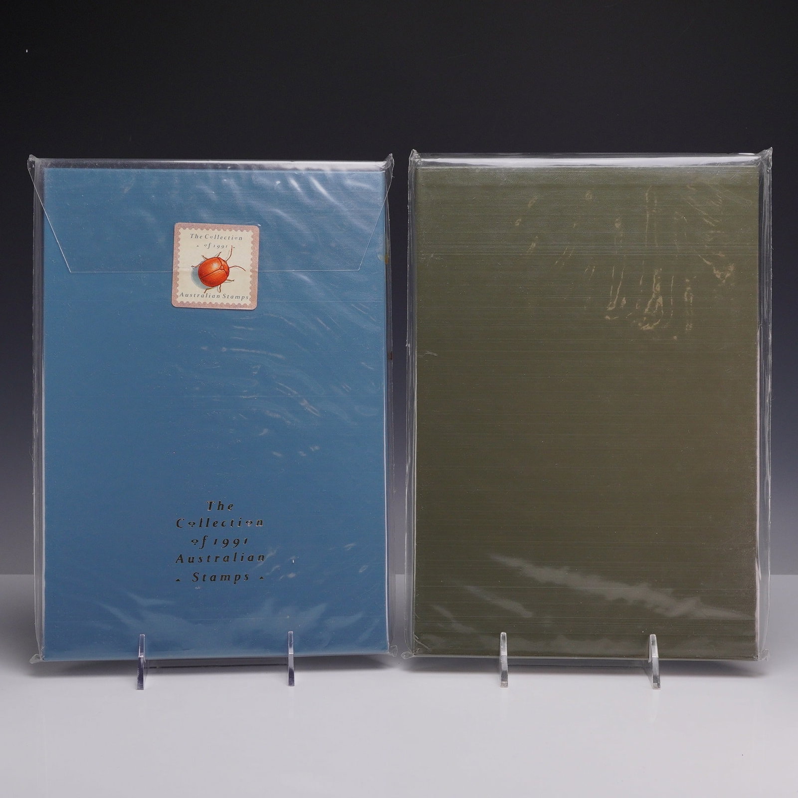 Set of Two Australian 1991 and 1992 Annual Stamp Collections, Deluxe Editions: This lot consists of two Australia Post Deluxe Edition Annual Stamp Collections for the years 1991 and 1992. Each collection is a hardbound book housed in a matching slipcase and protected by a clear 