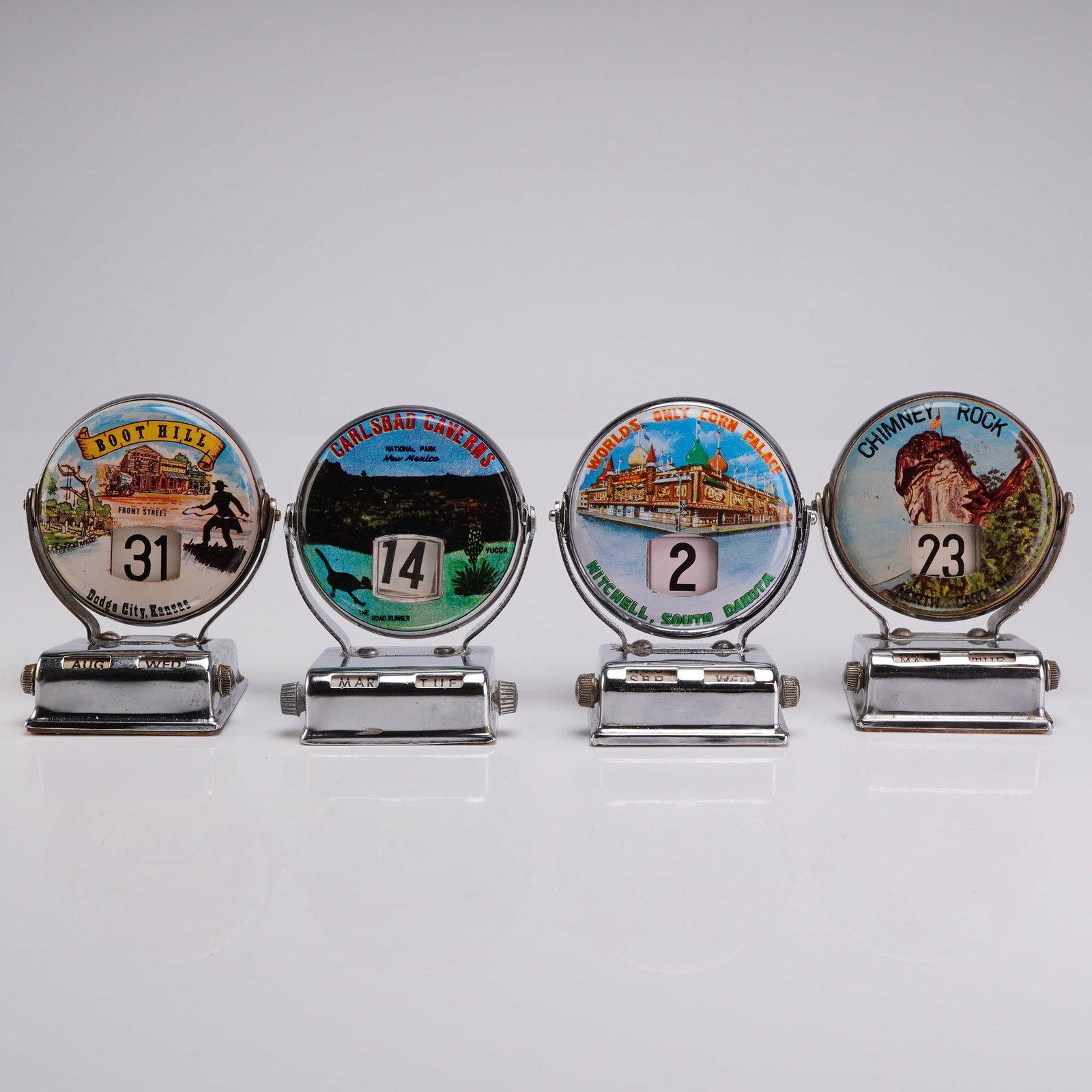 Four Vintage Japanese Mechanical Perpetual Flip Roll Top Souvenir Desk Calendars: This group of four vintage mechanical perpetual flip-desk calendars, also known as roll top calendars, was manufactured in Japan during the mid-20th century for the United States tourist market. Each 