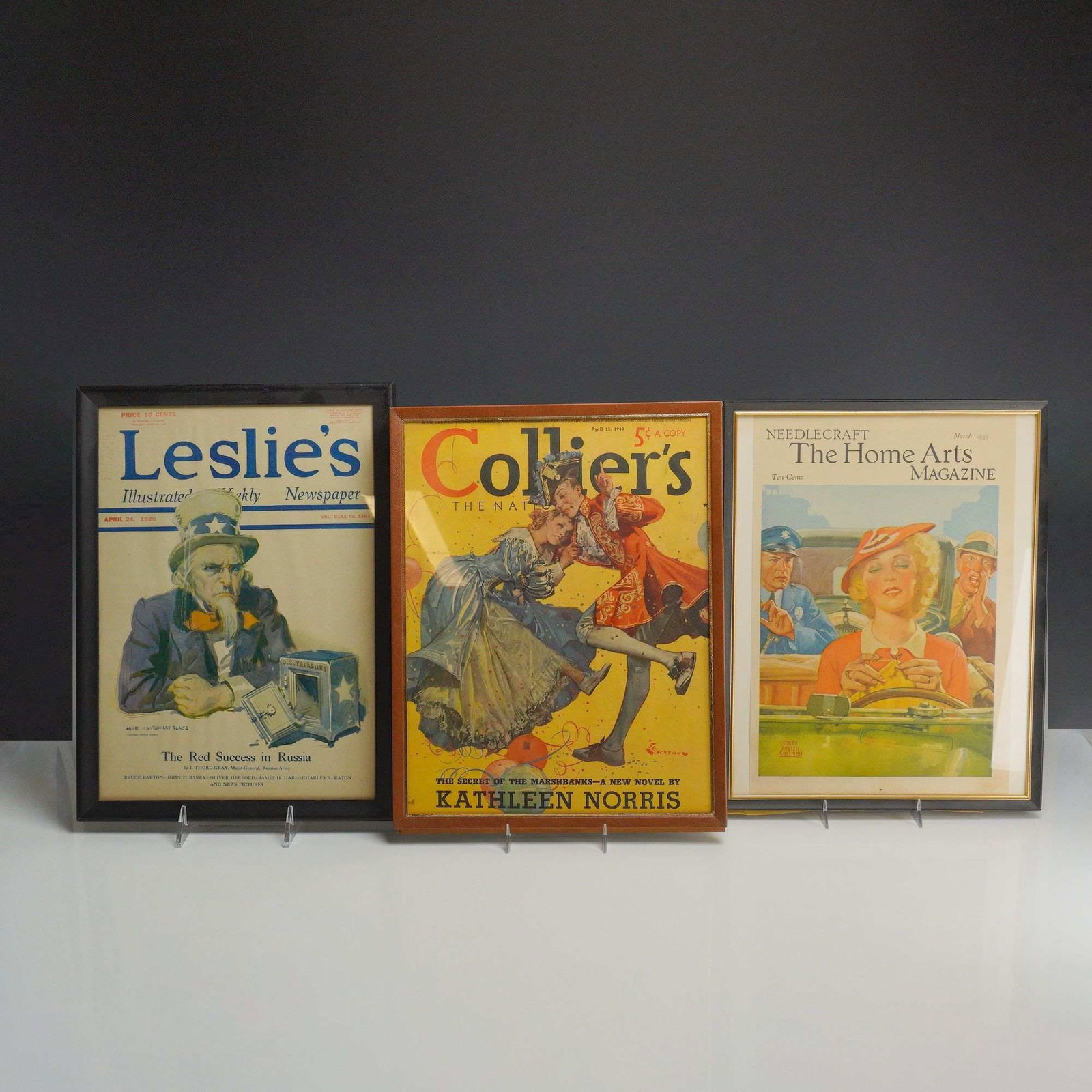 3pc Framed American Magazine Covers, Various Publishers, 1920-1940.: This collection consists of 3pc framed covers from American magazines. The first item is a cover from Leslie's Illustrated Weekly Newspaper, dated April 24, 1920 (Vol. CXXX No. 3367), featuring a poli