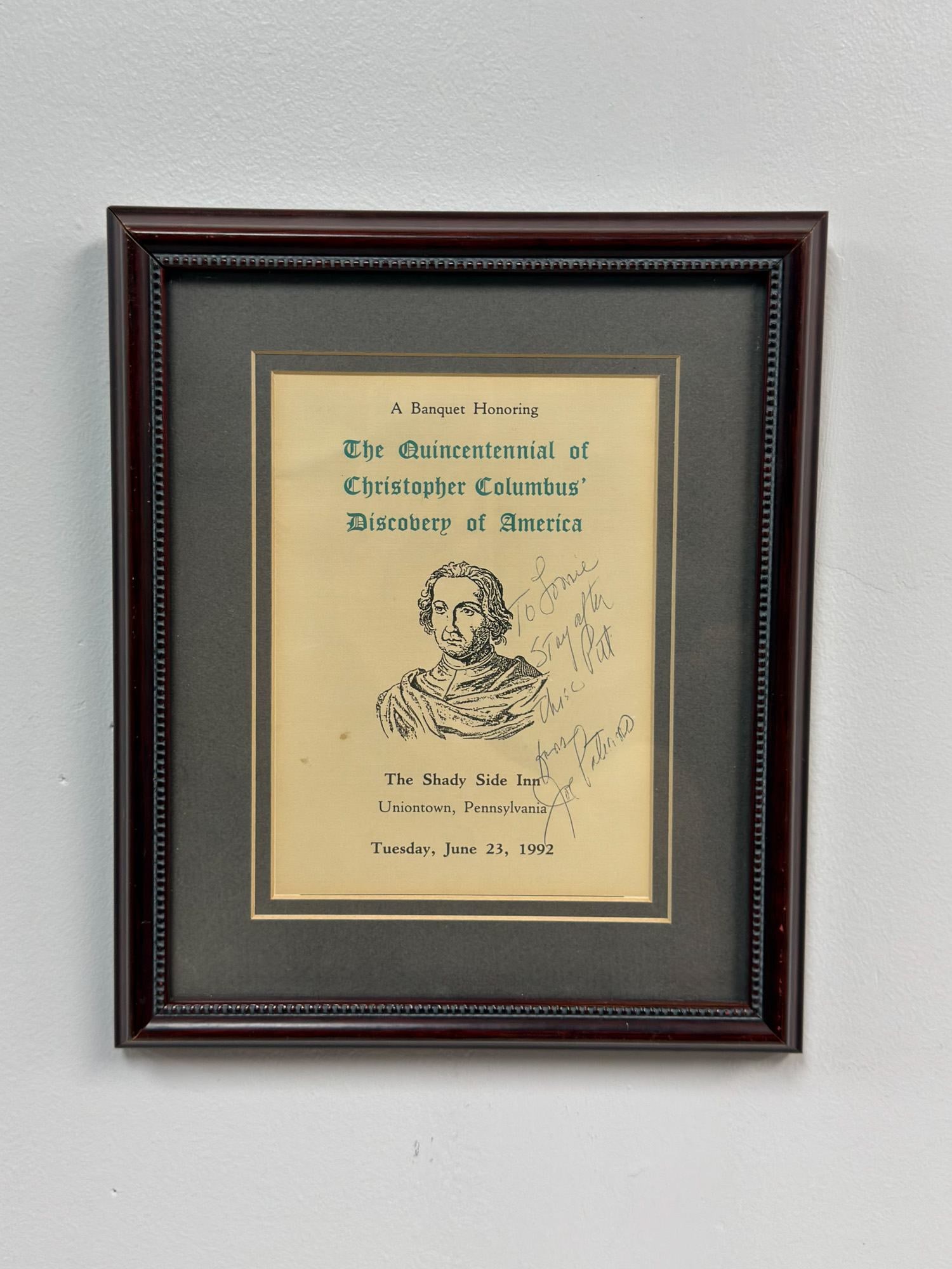 Pennsylvania Poster of Banquet Honoring Christopher Columbus, Signed by Joe Paterno: This framed item is a poster for A Banquet Honoring The Quincentennial of Christopher Columbus Discovery of America, held at The Shady Side Inn in Uniontown, Pennsylvania, on Tuesday, June 23, 1992. T