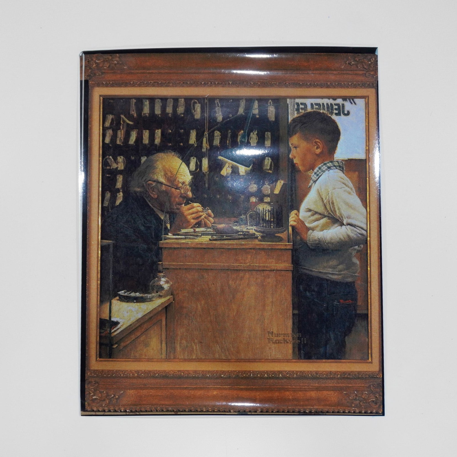 Norman Rockwell (American 1894-1978) Laminated Offset Lithograph, The Watchmaker (1 of 4)
