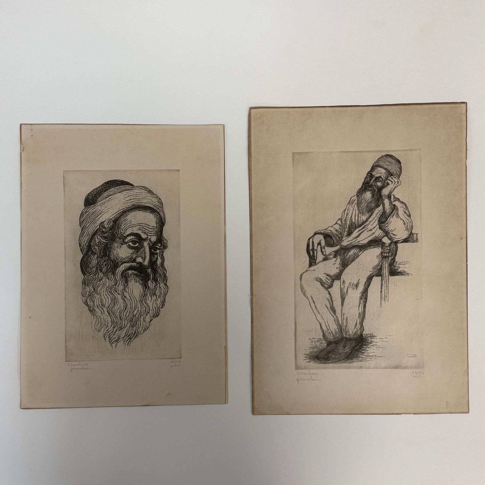 Jacob Eisenberg (Israeli, 1897-1965) Two Judaica Etchings on Paper: Two original Judaica etchings on paper by Jacob Eisenberg (1897-1966). The first etching is a portrait study of a bearded man wearing a turban, focused on the head and shoulders. The second etching de