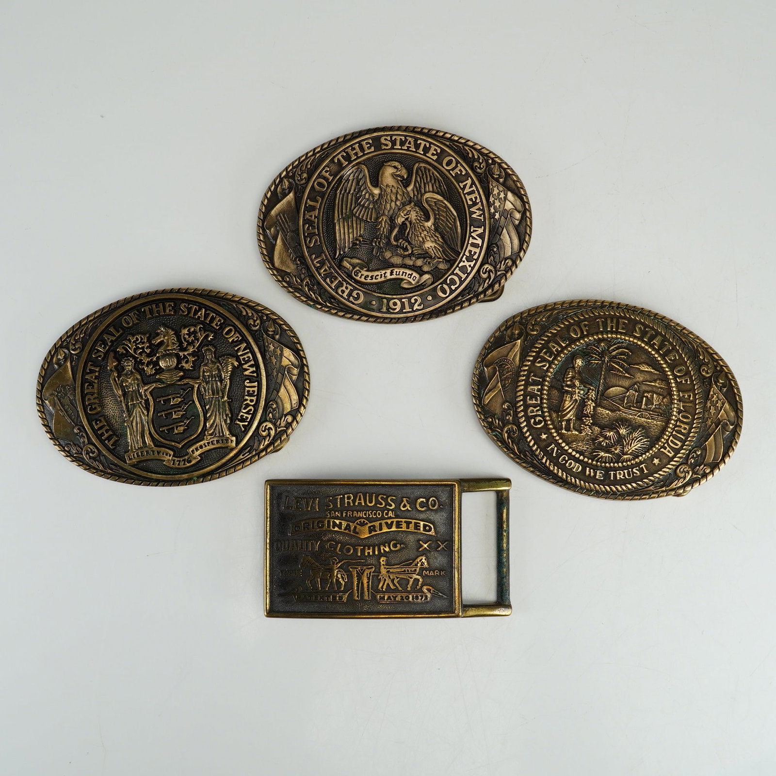 A Collection of Four Tony Lama and Levi Strauss & Co. Metal Belt Buckles (1 of 4)