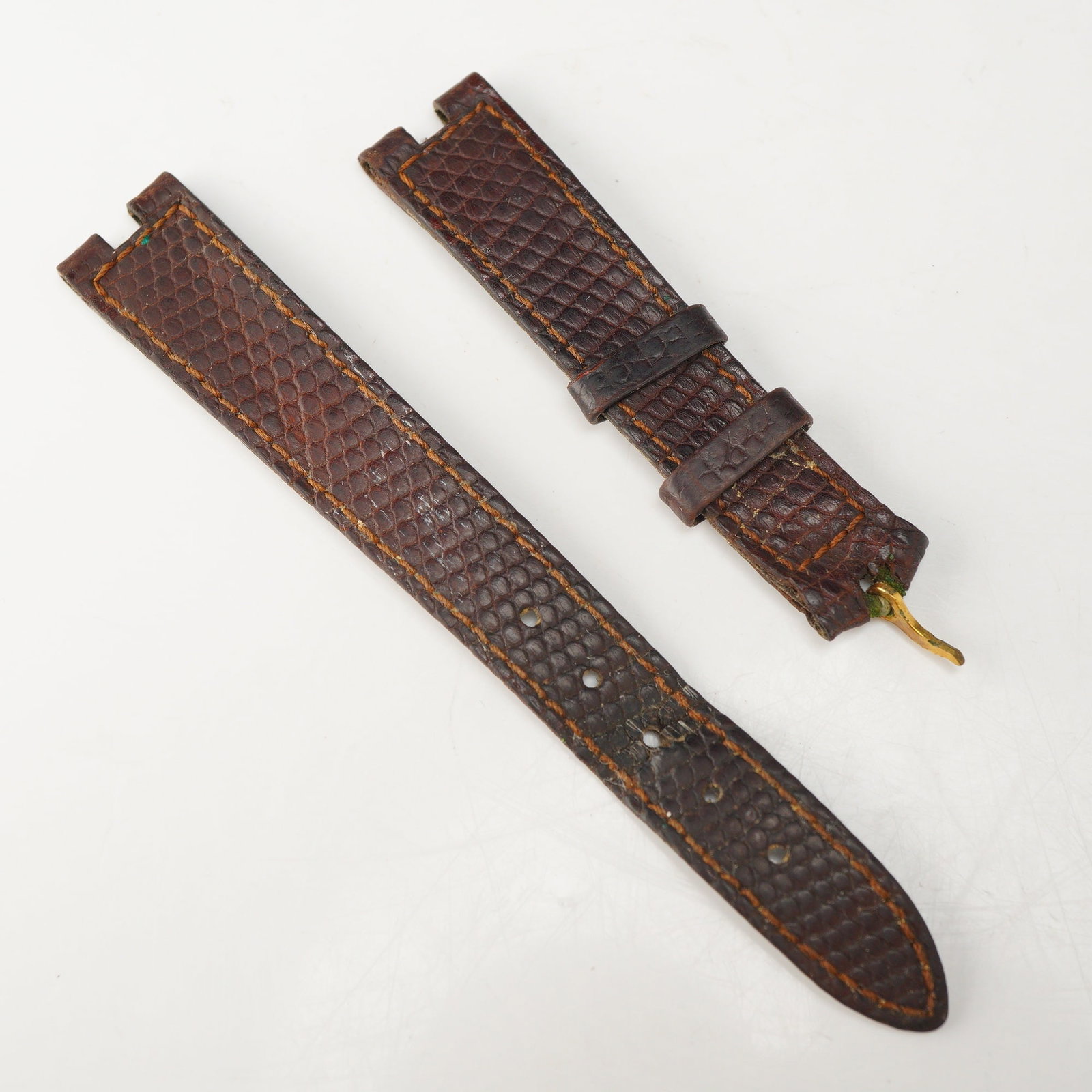 Cartier Brown Lizard Skin Watch Band Reference 1D07OCAA: This two-piece watch band is manufactured by Cartier and is crafted from brown lizard skin, identified on the packaging as Lezard Marron. The underside of the long strap section features the Cartier n