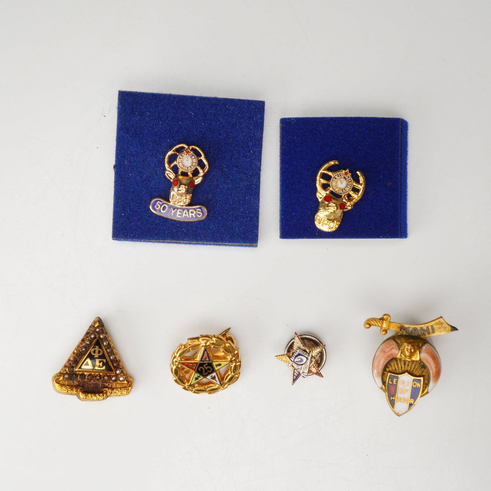 5pc Fraternal Pin Set including Masonic and BPOE Insignia: This 5pc fraternal pin set includes a variety of membership and service pins from several organizations. The collection features two Benevolent and Protective Order of Elks (BPOE) lapel pins presented