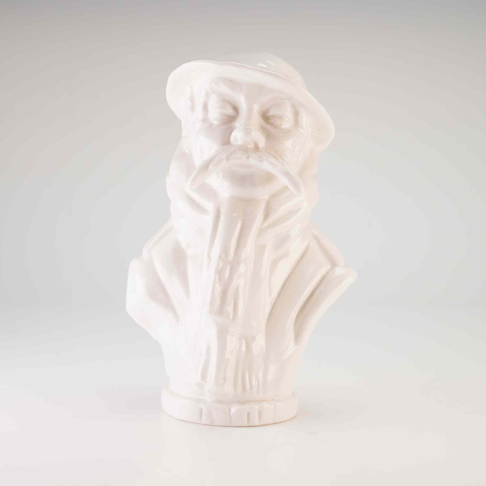 Michael Sutty Proof Glazed Porcelain Old Bill Bust: A glazed white porcelain bust produced by the Michael Sutty Porcelain Manufactory. The figurine depicts the character Old Bill, a World War I caricature created by Bruce Bairnsfather, featuring his pr