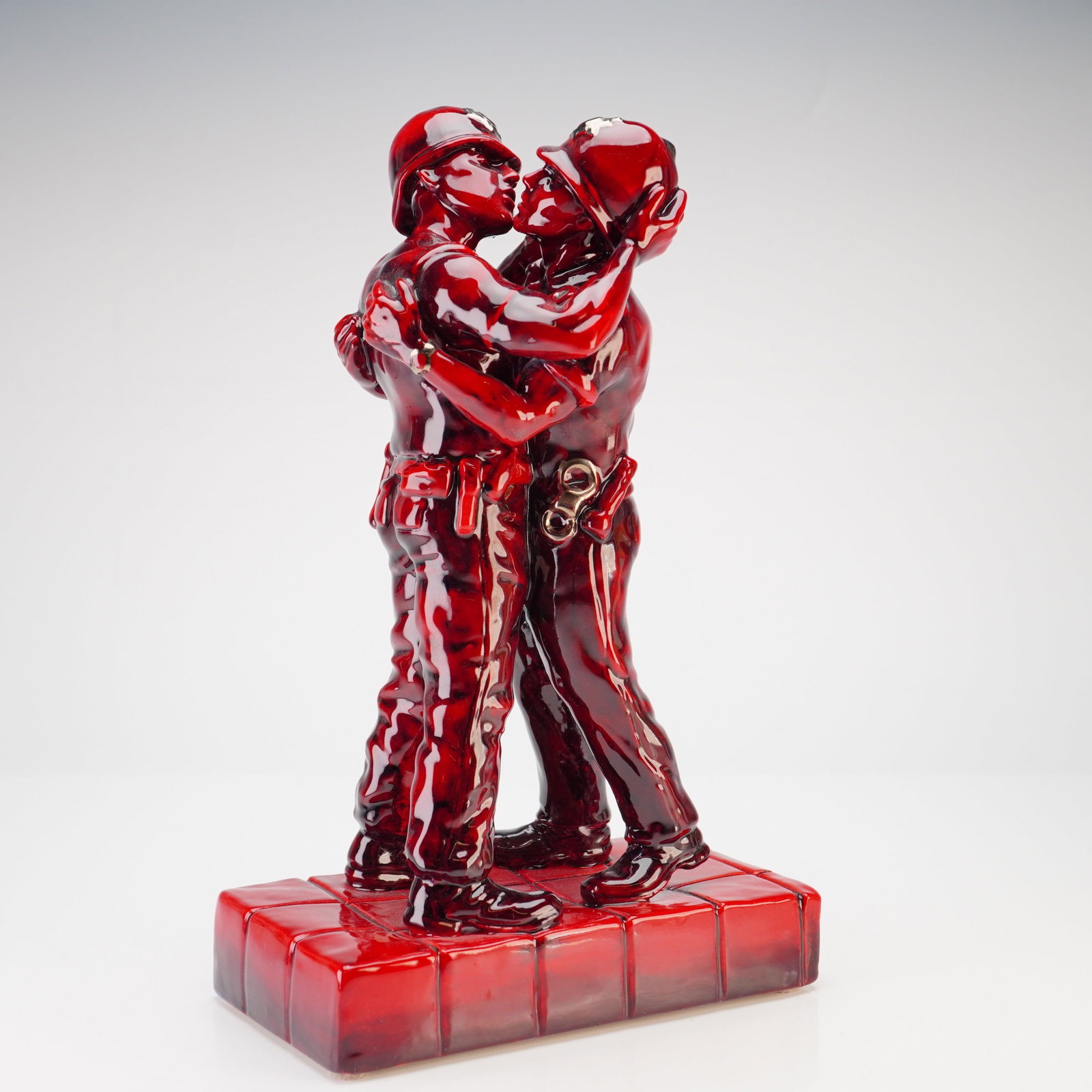 Kevin Francis Street Art Banksy Kissing Coppers Ruby Fusion Prototype Ceramic Figure: This unique glazed ceramic sculpture is produced by Kevin Francis Ceramics as part of their Street Art collection. The piece is a three-dimensional interpretation of the stencil artwork titled Kissing