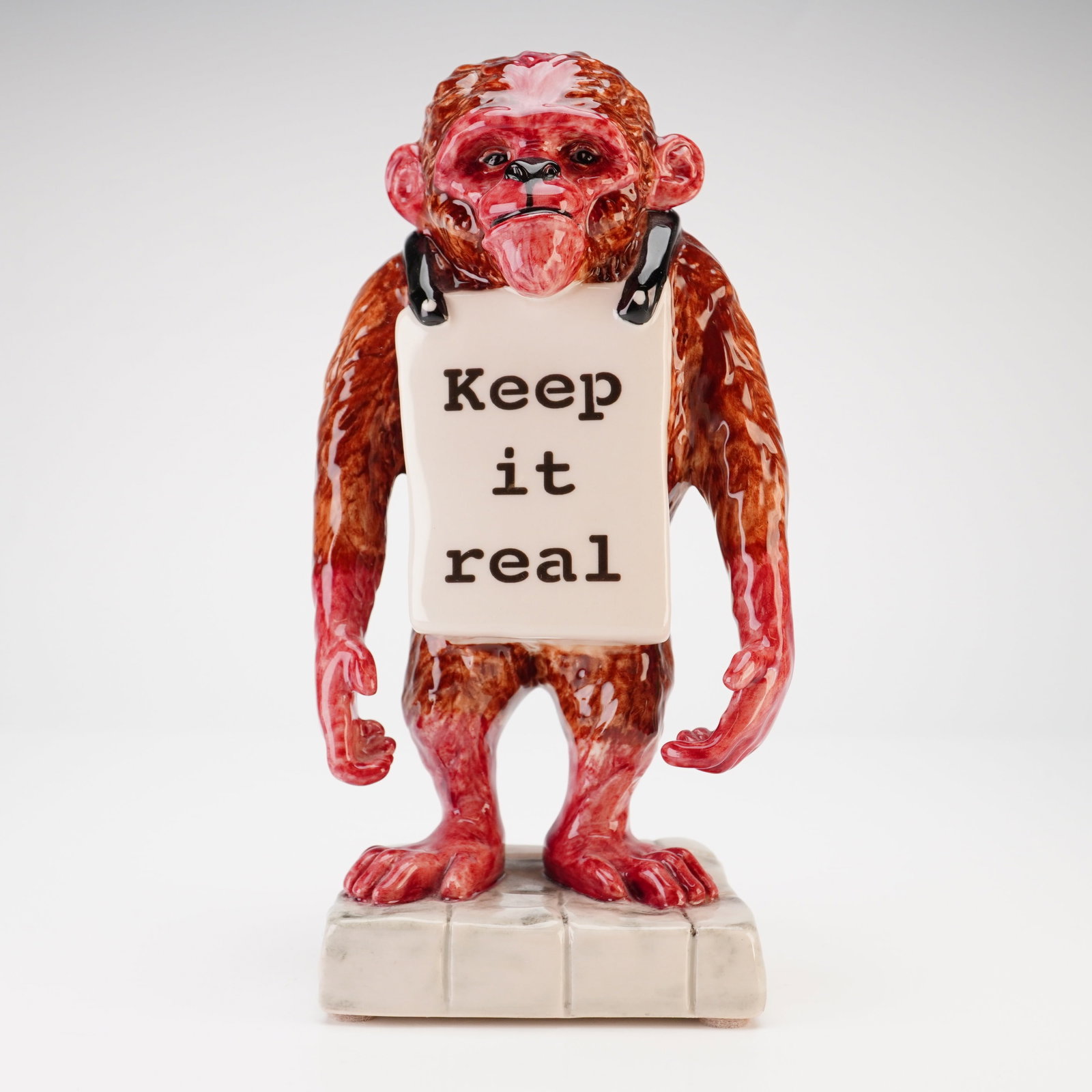 Kevin Francis Ceramics Banksy's Monkey Keep It Real Limited Edition Figurine: A glazed ceramic figurine produced by Kevin Francis Ceramics as part of the Street Art series. The figure depicts a standing chimpanzee wearing a sandwich board, a motif popularized by the street arti