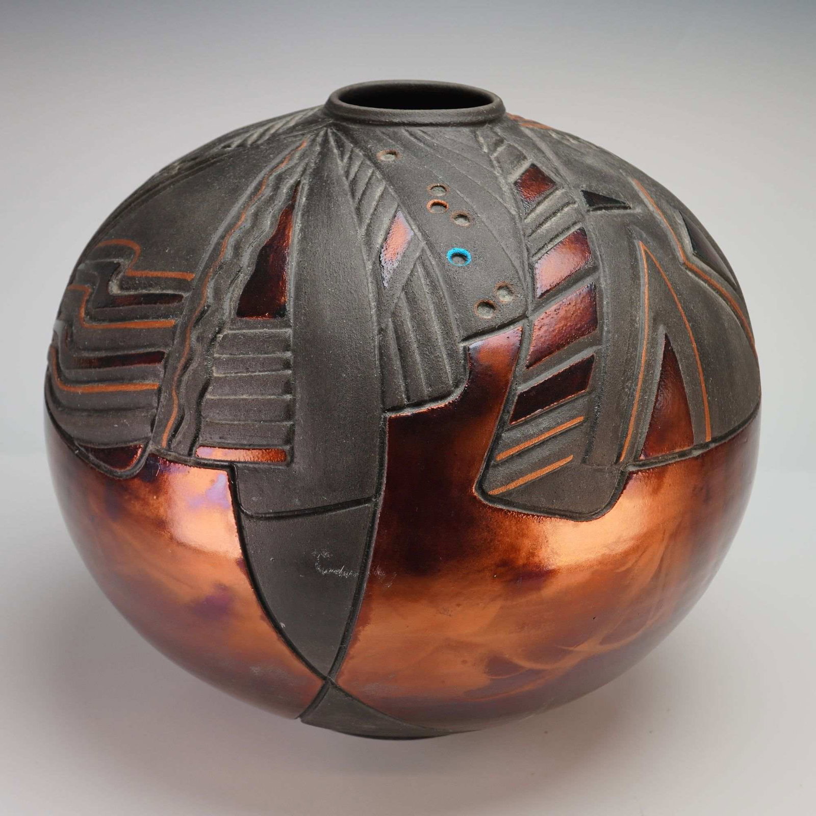 Christine Colombarini Signed Stoneware Sphere Vase: A large studio pottery stoneware decorative sphere vase by the artist Christine Colombarini. This high-shouldered globular form features a sophisticated raku-fired finish, characterized by a high-cont