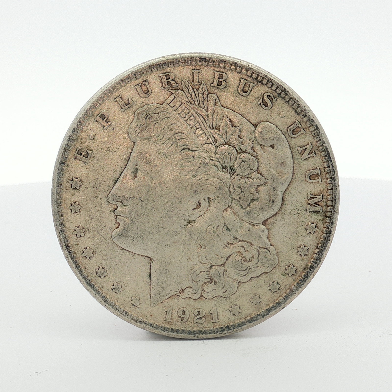 1921-S US Morgan Silver Dollar Coin Circulated: This 1921-S US Morgan silver dollar is struck in 90% silver. The coin features the Liberty Head obverse and the Eagle reverse. A small S mint mark for the San Francisco Mint is located on the reverse 