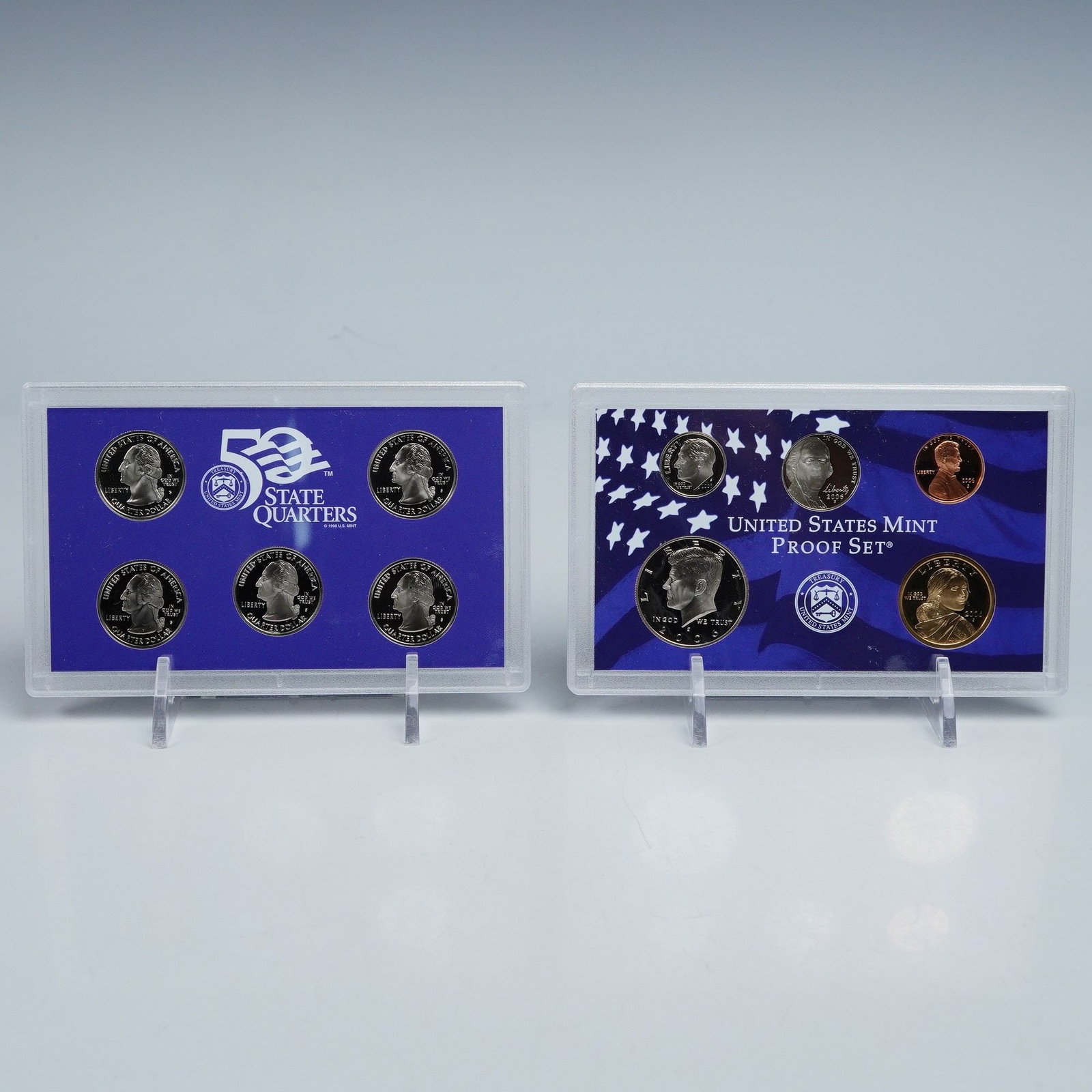 2006 United States Mint Proof and State Quarters Proof Set: Two United States Mint proof sets from 2006, including the United States Mint Proof Set and the 50 State Quarters Proof Set. The State Quarters Proof Set showcases Nevada, Nebraska, Colorado, North Da