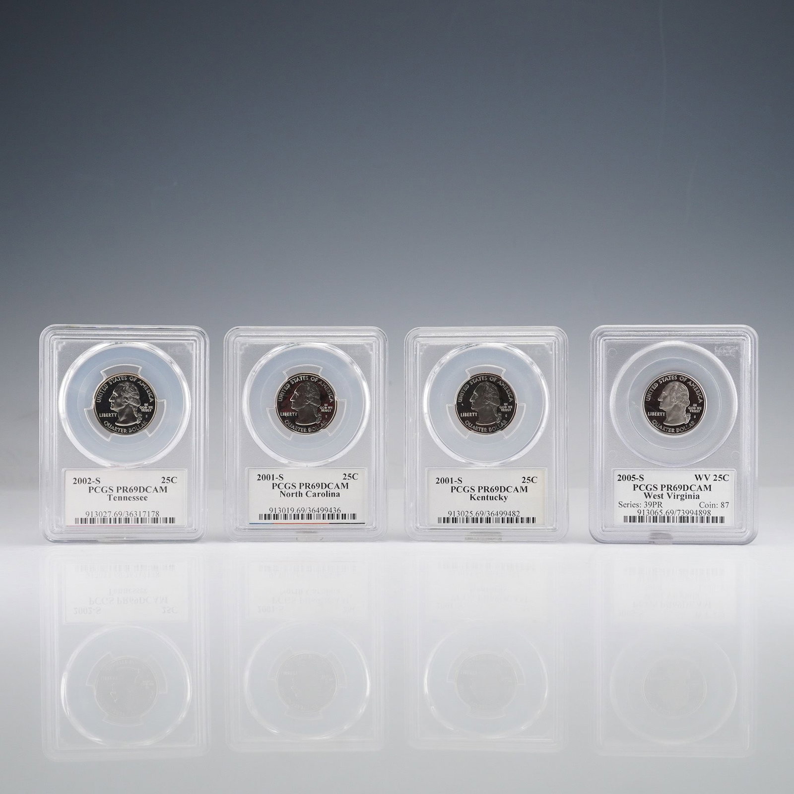 4pc US 2001-S, 2002-S, 2005-S State Quarters 25C Clad Proof PCGS PR69DCAM: A group of four US 50 State Quarters, all certified and slabbed by PCGS as PR69DCAM (Proof 69 Deep Cameo). The collection includes the 2001-S North Carolina, 2001-S Kentucky, 2002-S Tennessee, and 200