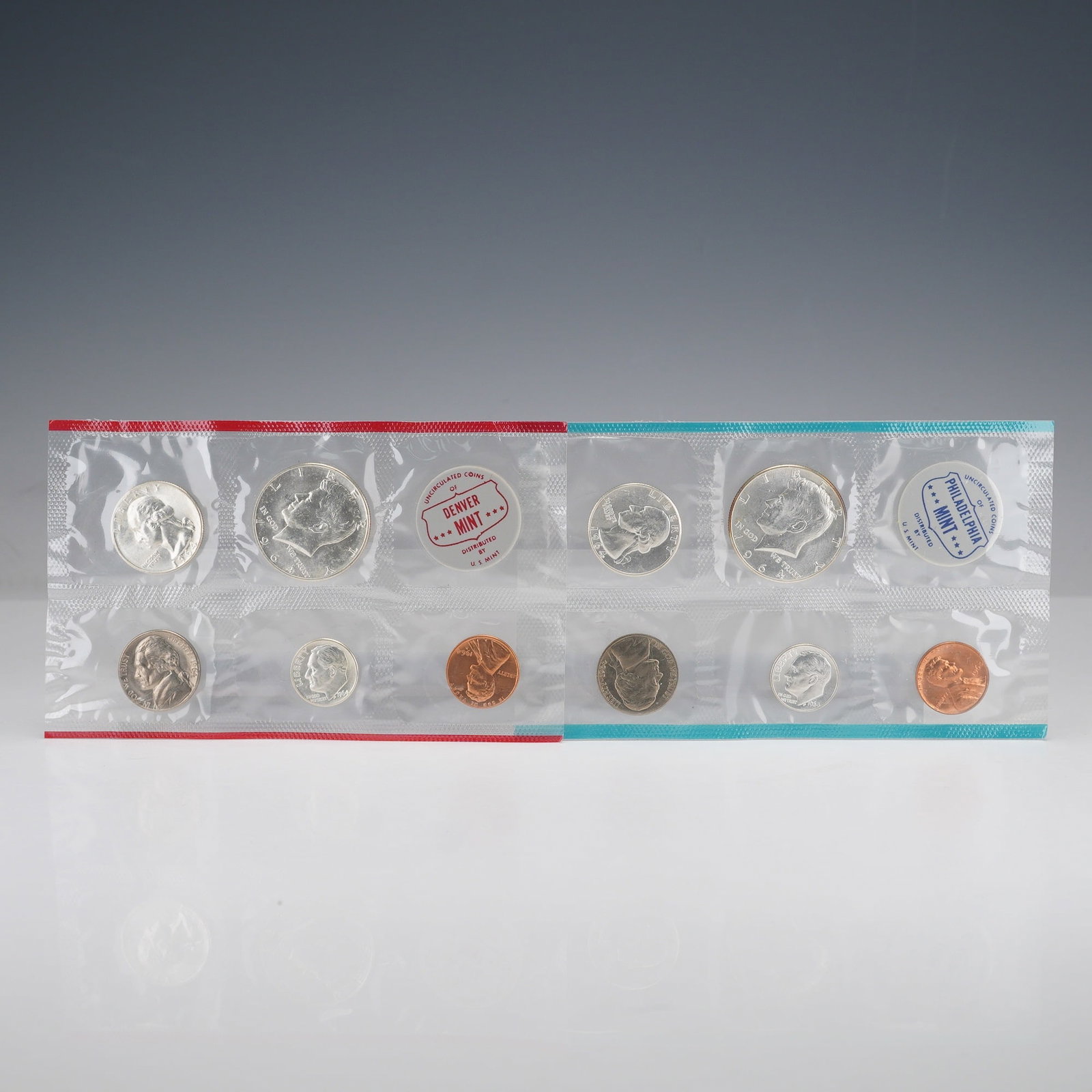 2pc 1964 United States Mint Proof Coin Sets: This 1964 United States Mint Uncirculated Coin Set features two complete collections of coins from both the Philadelphia and Denver Mints. Each set includes the Lincoln cent, Jefferson nickel, Rooseve