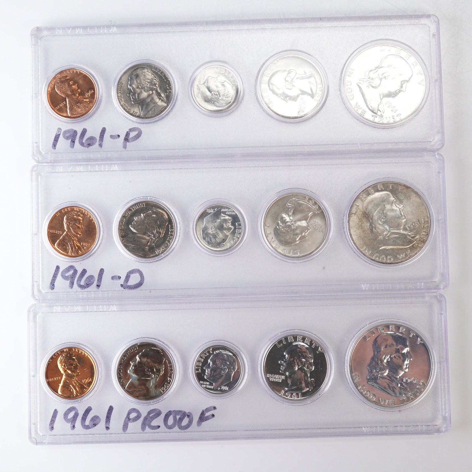 3pc 1961, 1961 D,P U.S. Mint Proof and Coin Sets: United States Mint coin sets, including the Philadelphia (P) uncirculated set, the Denver (D) uncirculated set, and the 1961 Proof Set, each housed in rigid holders with handwritten labels. Each set c