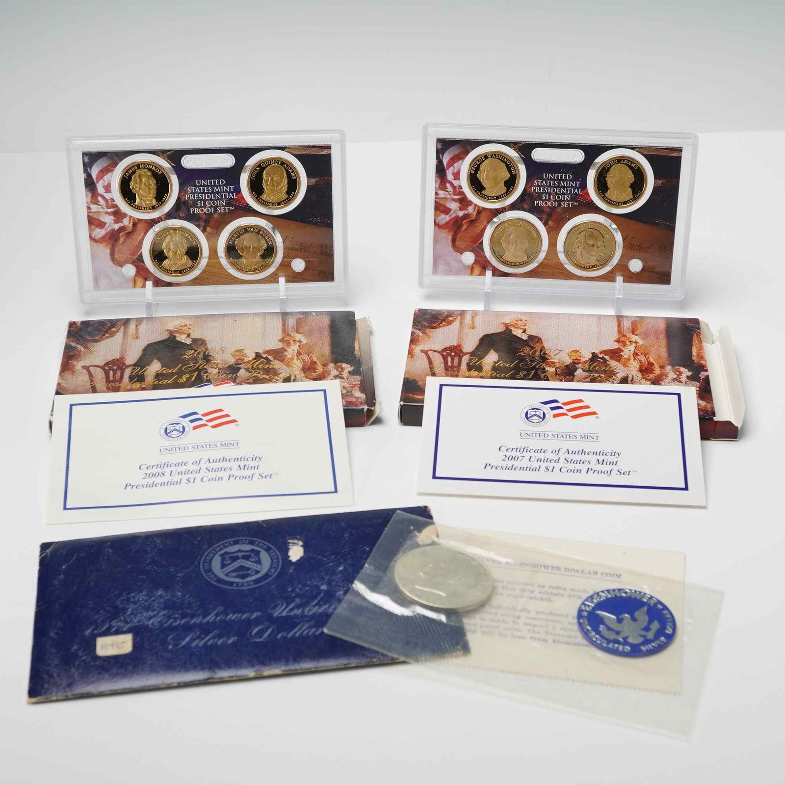 3pc 1971, 2007 & 2008 U.S. Presidential $1 Coin Proof Sets: Coin Proof Sets, representing multiple years of the modern Presidential Dollar Program and one earlier silver issue. Included are 1971 Eisenhower Silver Dollar - Original U.S. Mint blue envelope with 