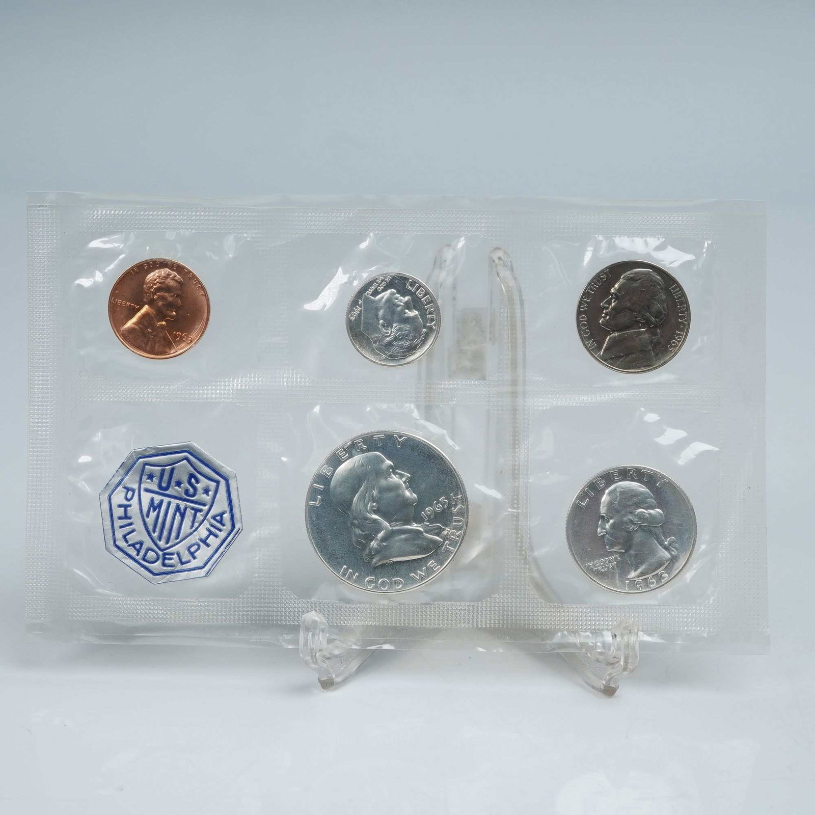 1963-P Set of 5 Coins and a Token: This official mint set includes five coins and one U.S. Mint token, all sealed in original government packaging. The set comprises a Lincoln Cent, Jefferson Nickel, Roosevelt Dime, Washington Quarter,