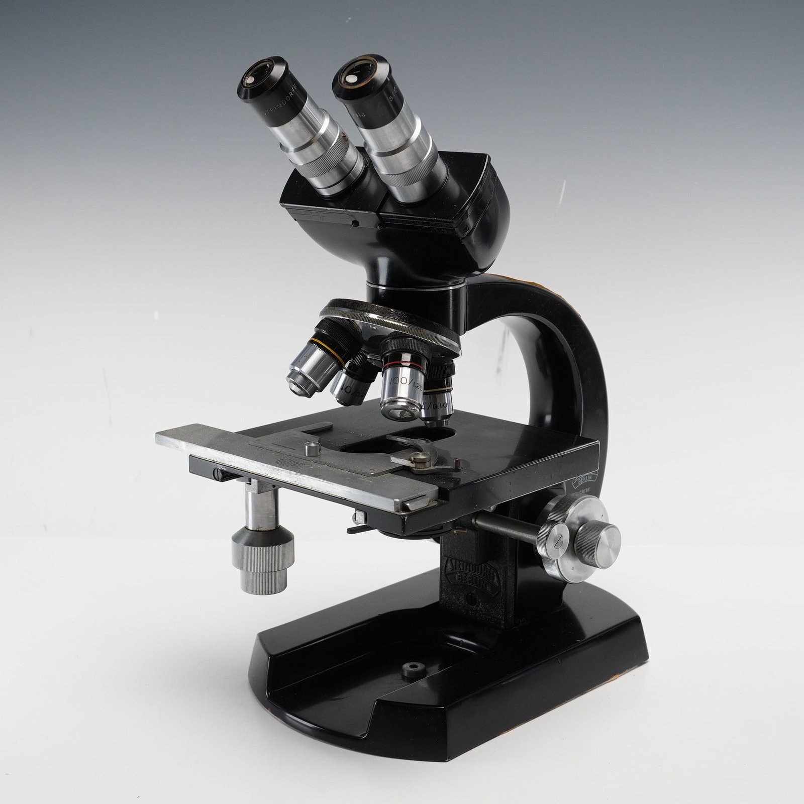 Steindorff Berlin Binocular Microscope with Carrying Case and Sample Bottles: This professional binocular compound microscope, manufactured by Steindorff and Co. of Berlin, is constructed with a sturdy black-enameled frame and polished chrome hardware. The binocular head includ