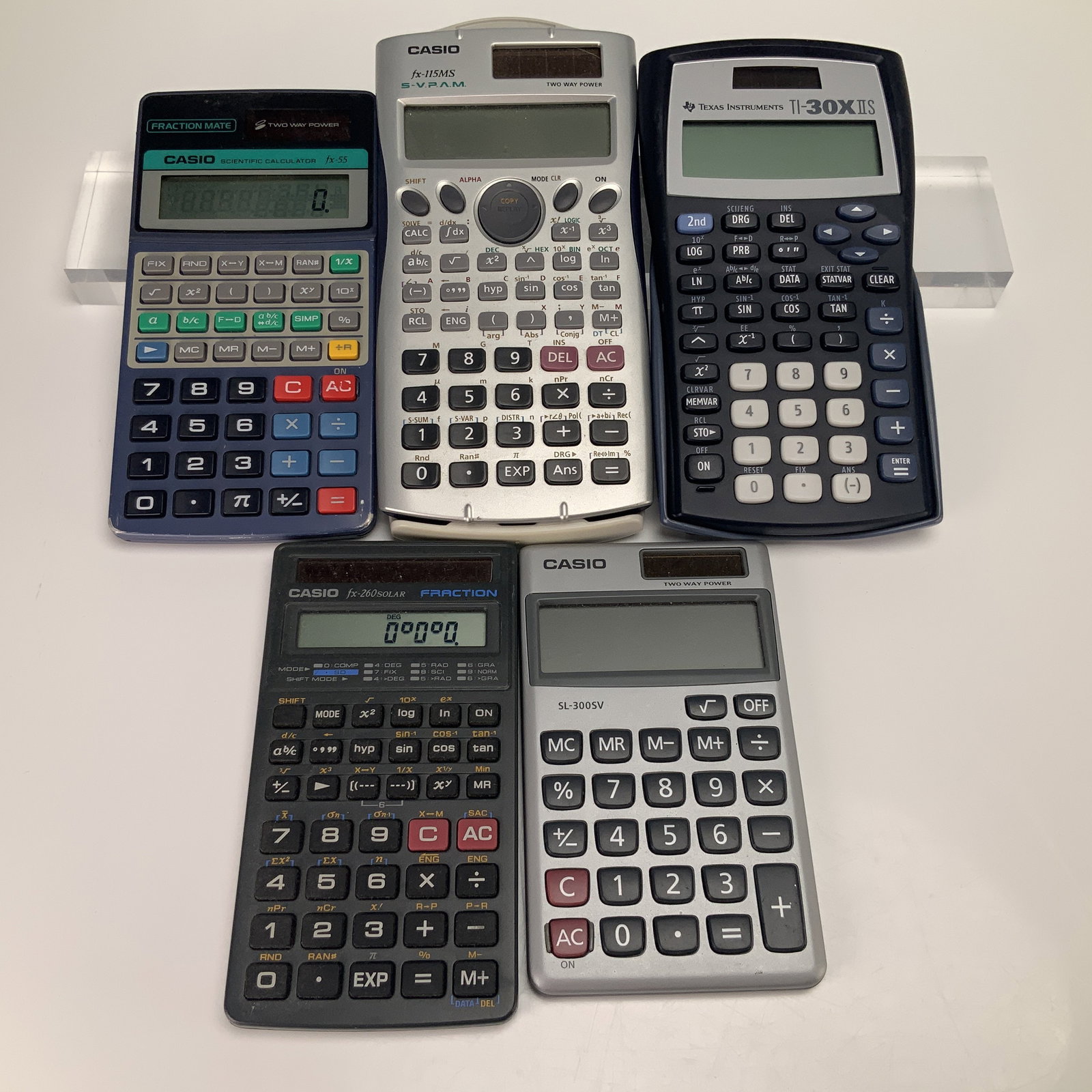 A Collection of 5 Casio and Texas Instruments Scientific and Standard Calculators (1 of 3)