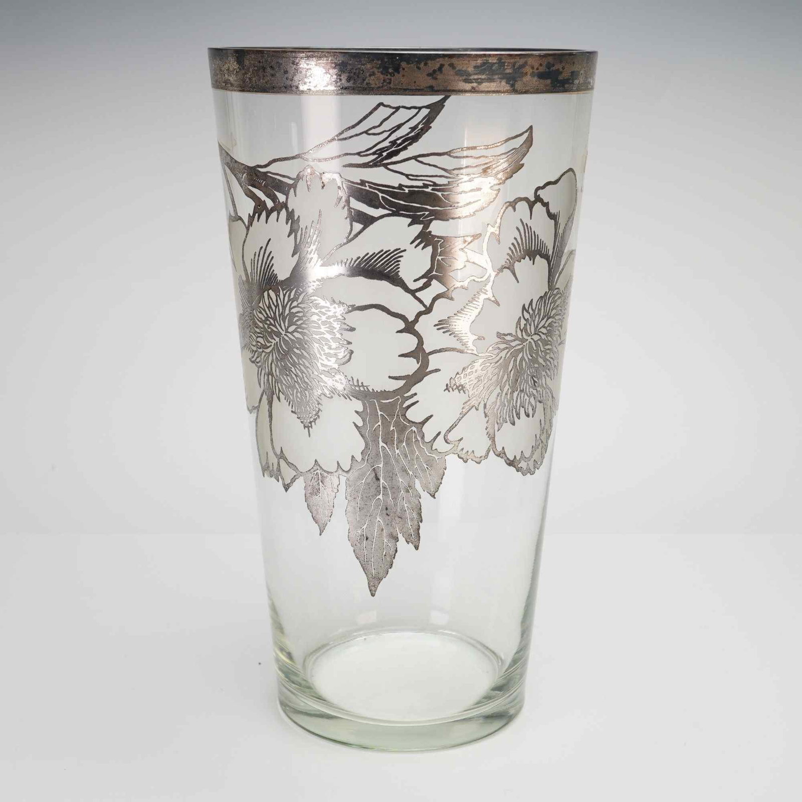 Attributed to Silver City, Flanders Pattern, Clear Silver Overlay Glass Flower Vase: This mid-century modern clear glass flower vase is attributed to the Silver City Glass Company, featuring the distinctive Flanders pattern. The piece showcases a sophisticated silver overlay design wi