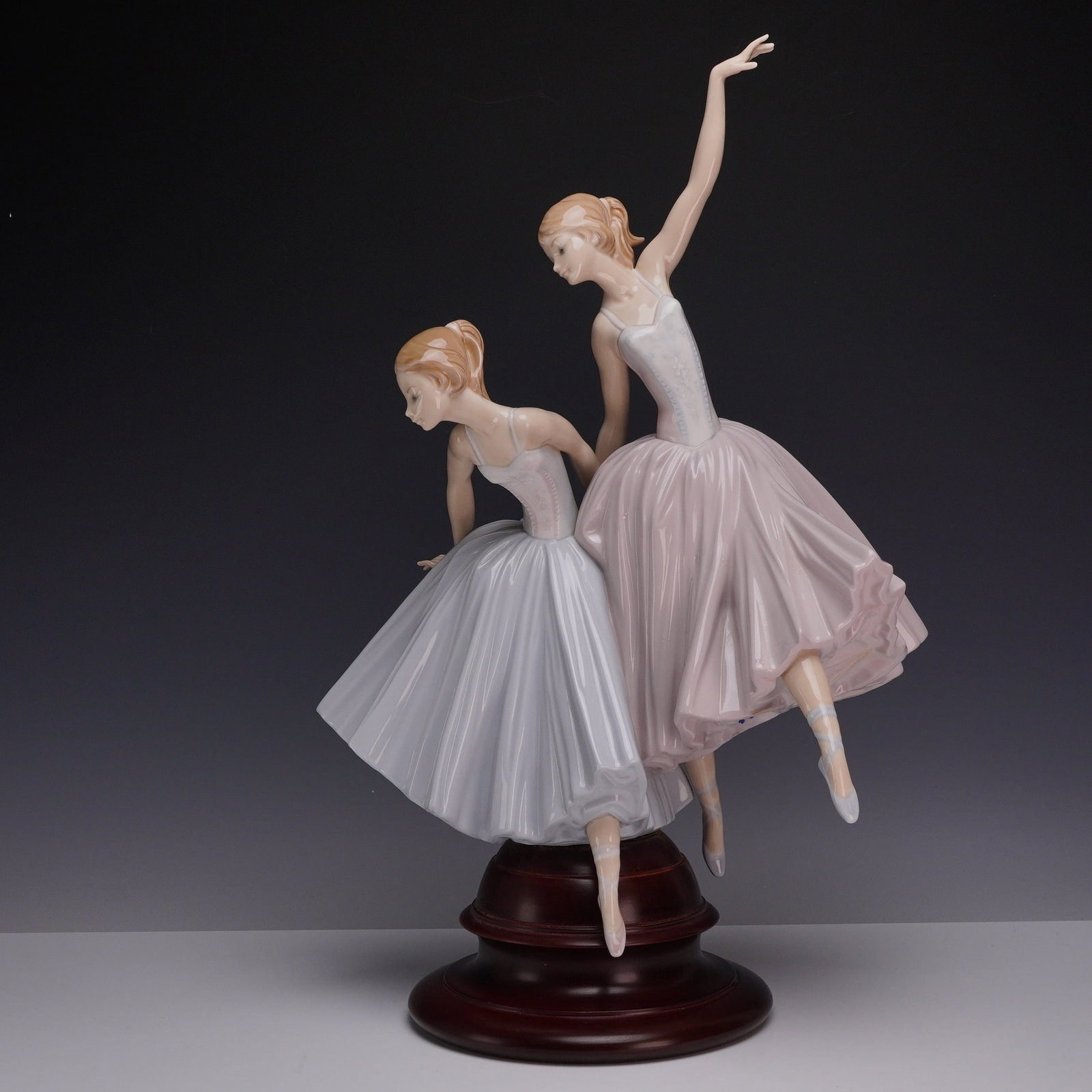 Lladro Spanish Porcelain Figurine Act II Model 5035: A Lladro porcelain figurine titled Act II, model number 5035, originally sculpted by Salvador Debon. The piece depicts two young female ballet dancers in a graceful pose. One ballerina is dressed in a