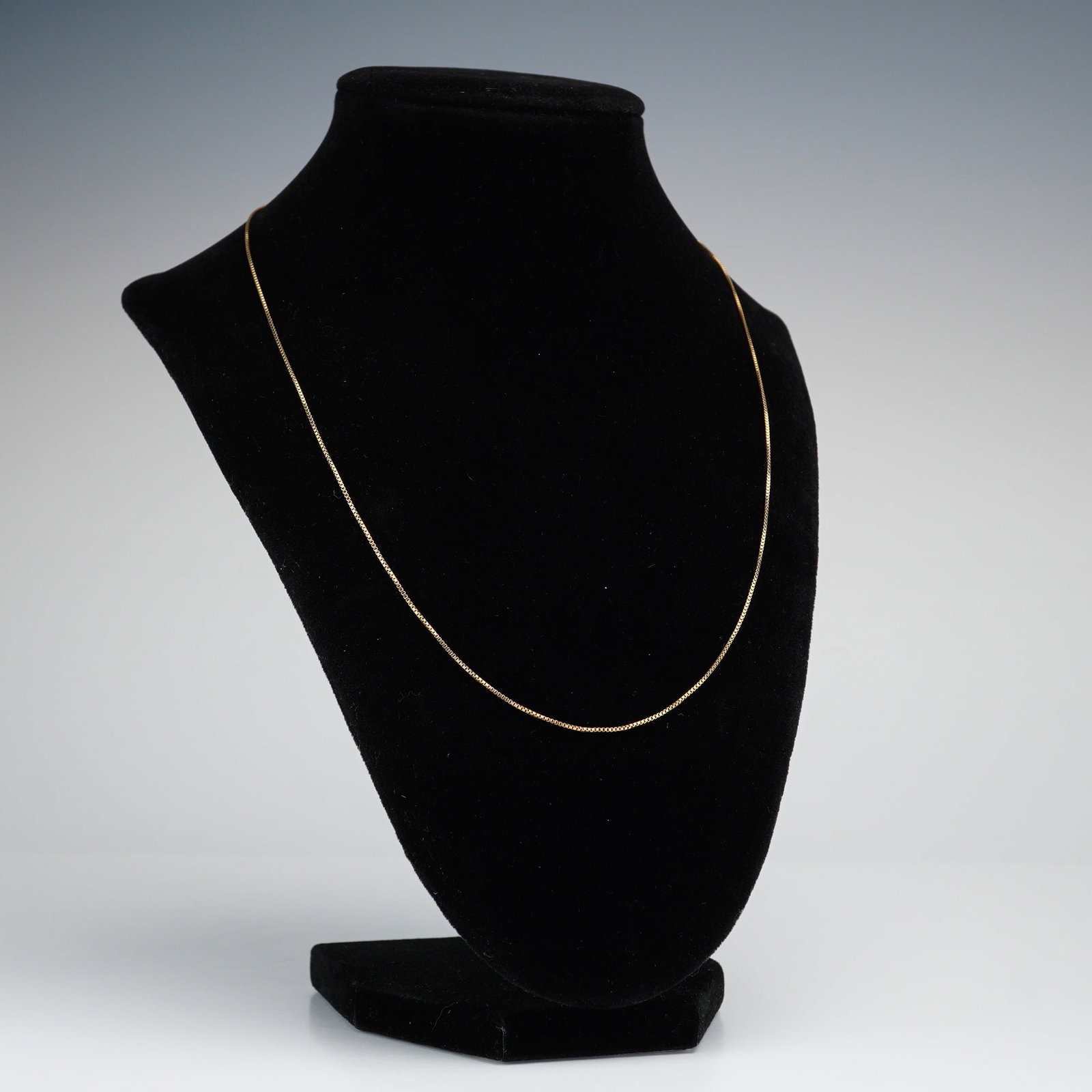 Italian Gold-Plated Sterling Silver Box Chain Necklace: A box chain necklace crafted from gold plated sterling silver with a spring ring clasp. Marked 925, Italy, and GM. Dimensions: 20"L Country of Origin: Italy Weight: 2.11 g