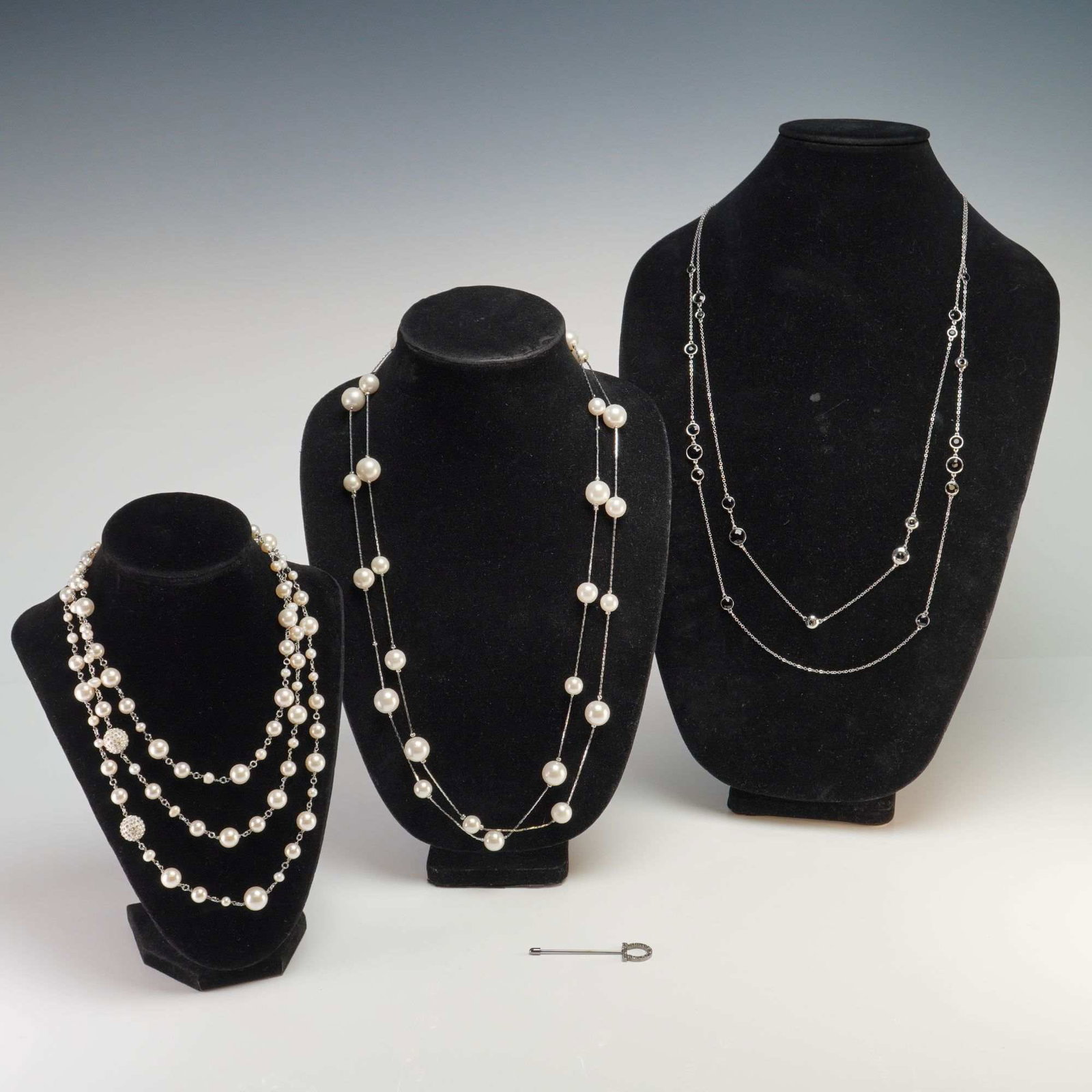 4pc White House Black Market Necklaces & Pave-Set Stick Pin: A group of four contemporary jewelry items. The first necklace by White House Black Market (WHBM) features a multi-strand design incorporating varying sizes of spherical cream-colored faux pearls and 