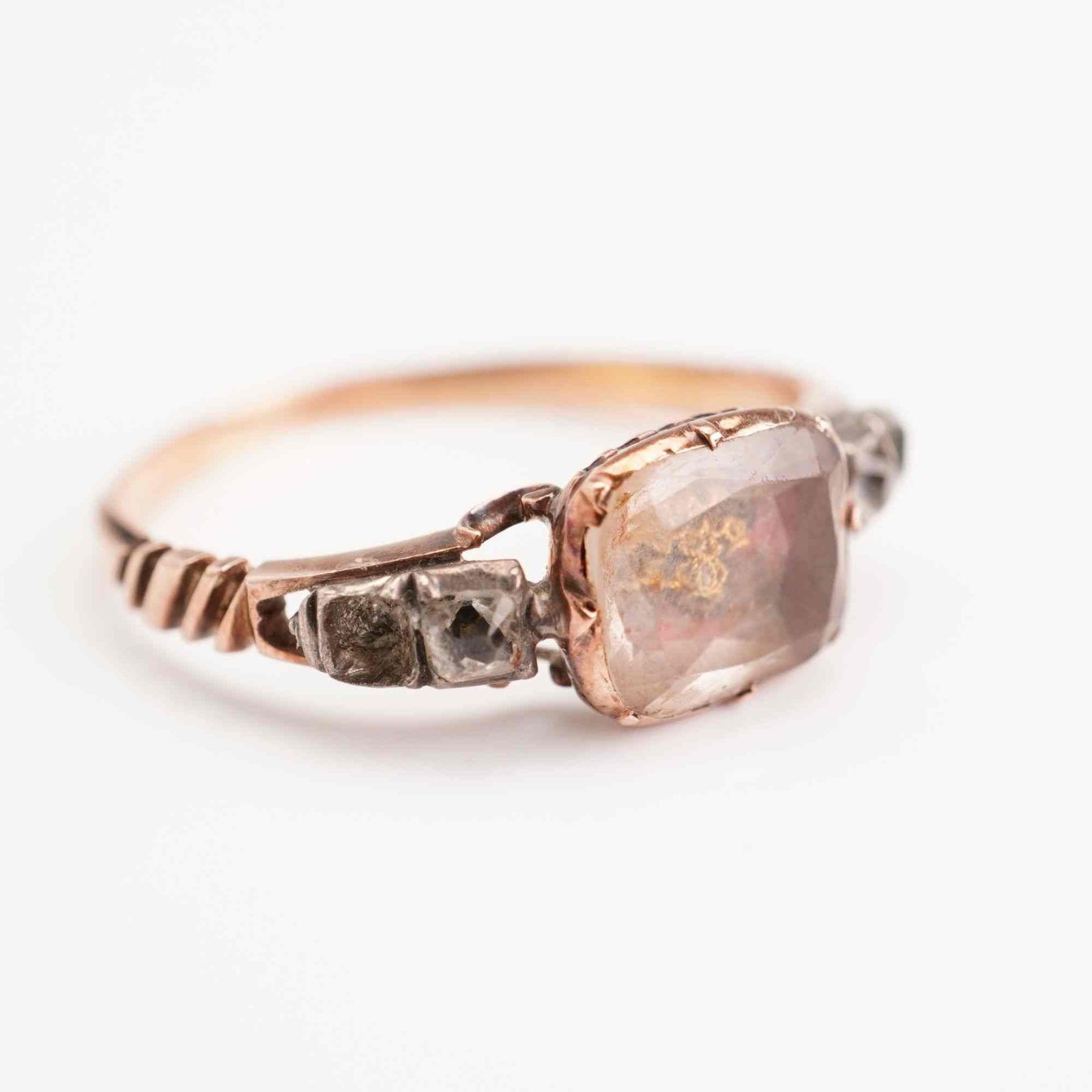 10K Rose Gold and Silver Memorial Cypher Ring with Rose Cut Diamonds: This antique memorial-style ring is crafted from 10K rose gold with silver-topped settings, a construction technique characteristic of historical jewelry. The centerpiece features a rectangular, facet