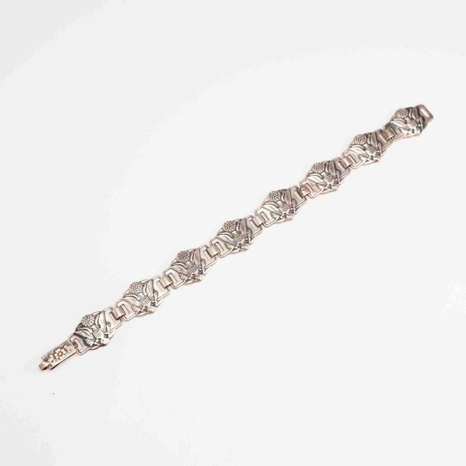 Craft By Coro Sterling Silver Link Bracelet: This vintage sterling silver link bracelet was manufactured by the American firm Coro as part of their high-end Craft line. The bracelet is composed of eight cast circular links joined by rectangular 