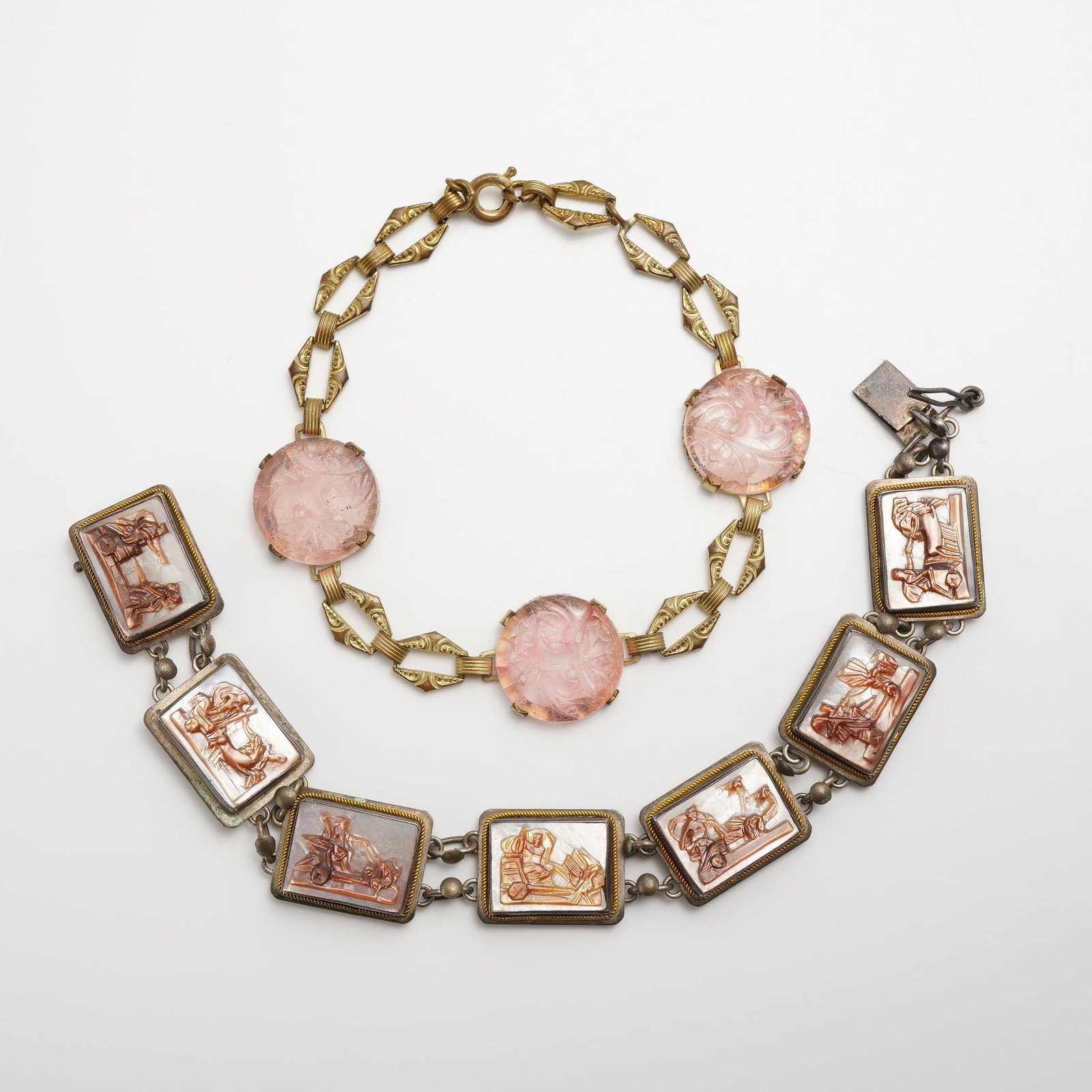 2pc Cameo Panel and Floral Glass Link Bracelets: This two-piece set includes a cameo bracelet and a pink glass necklace. The bracelet features seven rectangular shell cameos, each hand-carved with unique classical scenes and set in silver-tone rope-