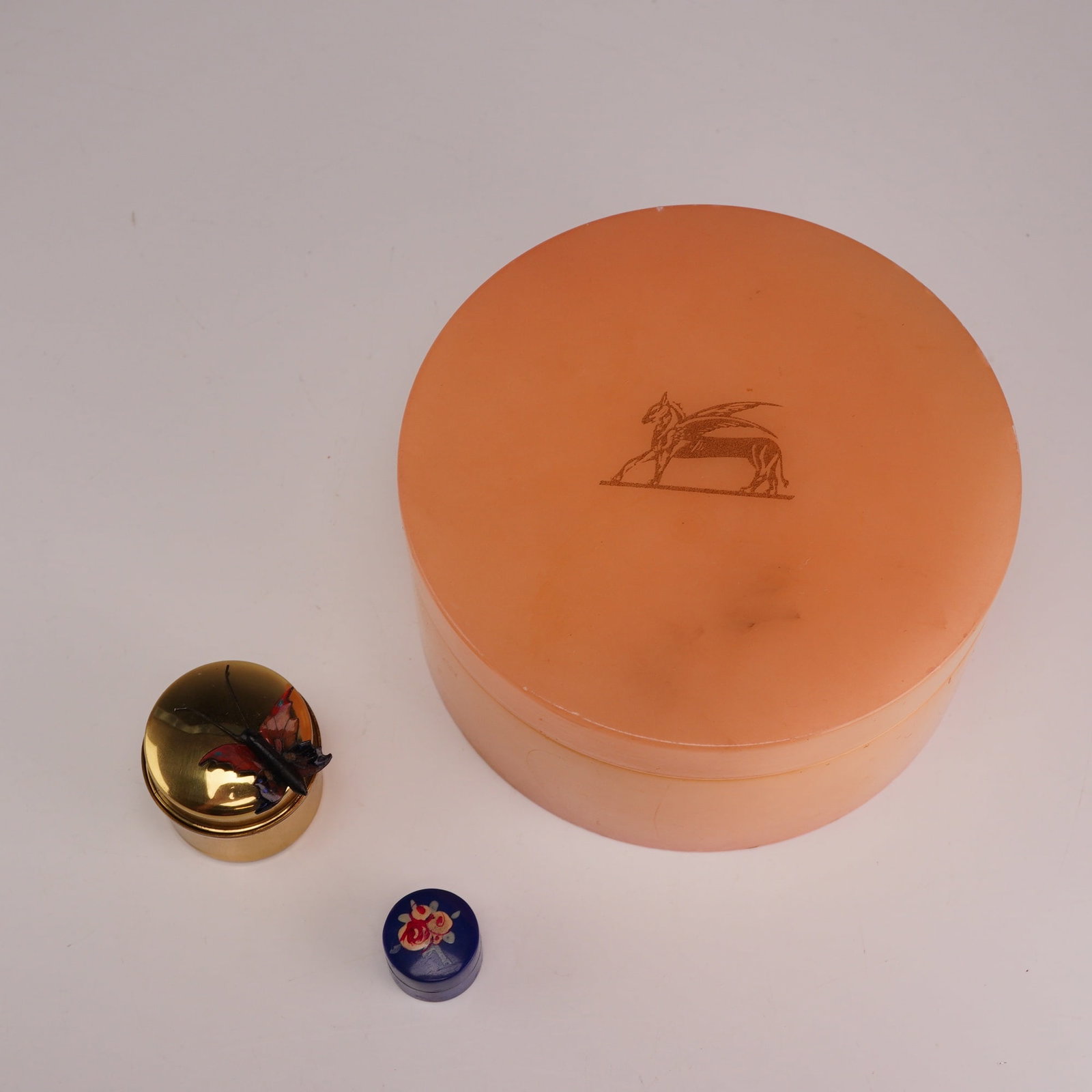 3pc Trinket Jewelry Boxes Including Italian Alabaster, Aminaco Colombia & French Design: A set of three round trinket jewelry boxes of varying materials and origins. The largest container is a round lidded box made of genuine pink alabaster stone, hand-carved and polished in Italy. The li