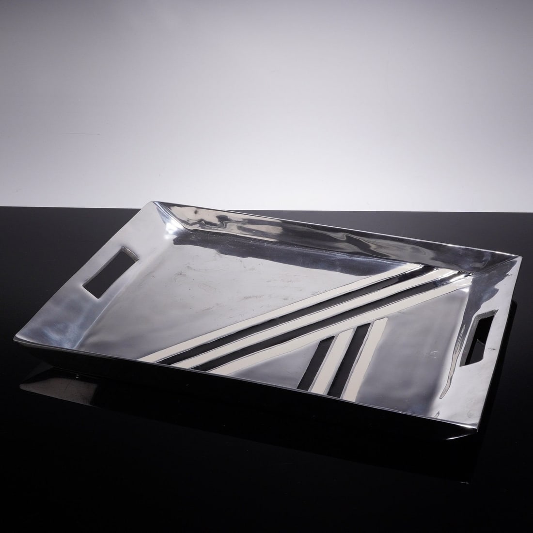 Nima Oberoi for Lunares Bianco Nero Aluminum Serving Tray: This contemporary rectangular serving tray is designed by Nima Oberoi for Lunares as part of the Bianco Nero collection. The piece is crafted from hand-cast aluminum with a high-polish finish. The dec