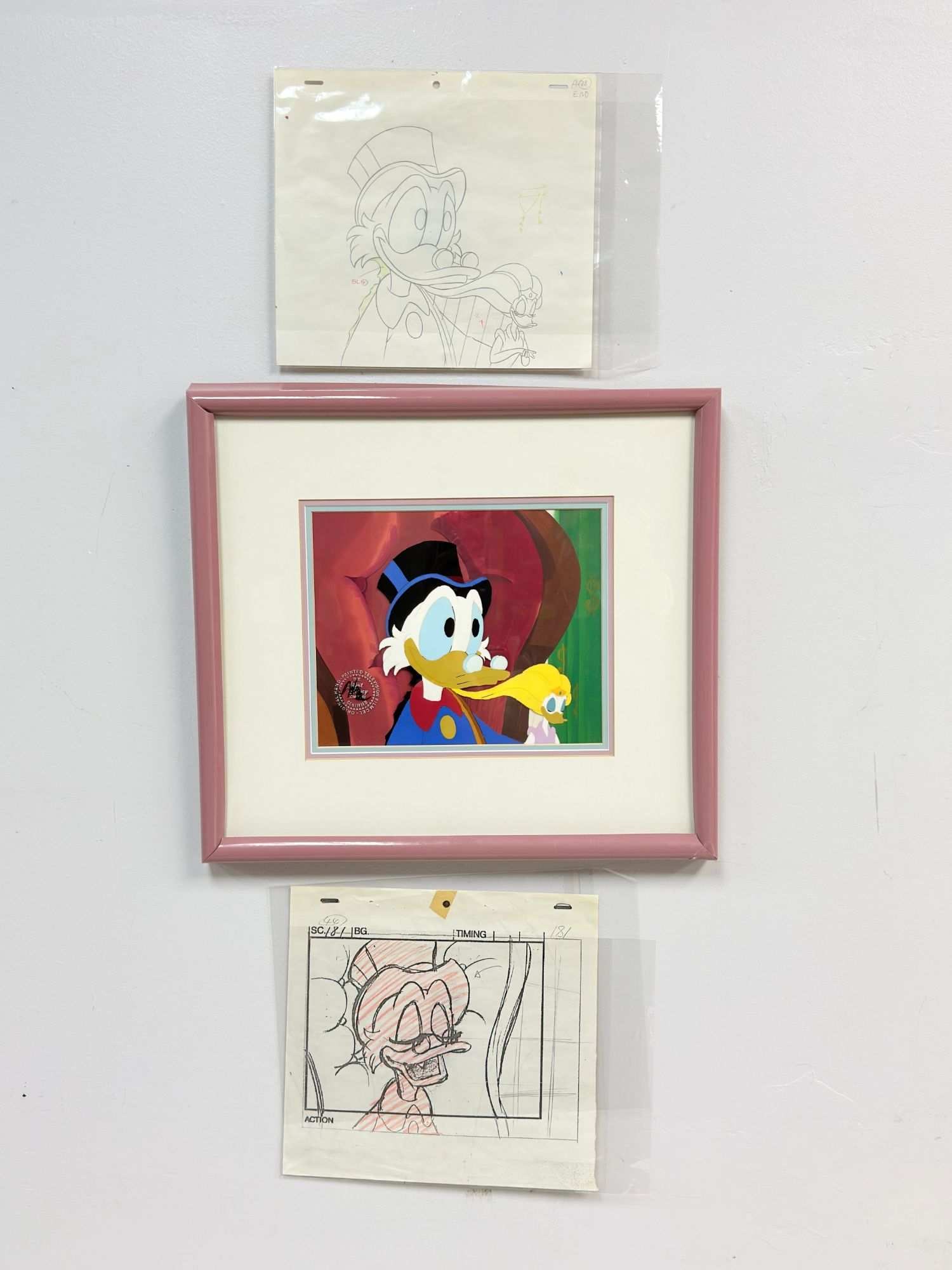 Wendell Washer (American, 1947-2022), Hand-painted Celluloid & Graphite Sketches, DuckTales, Signed: A trio of original production materials from the 1987 Disney animated television series DuckTales. The group includes one hand-painted production celluloid (cel) and two graphite animation drawings. T