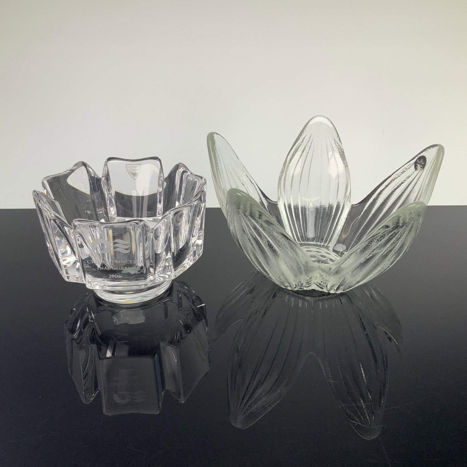 Two Crystal Bowls, Orrefors Royal Princess Inaugural and Rosenthal Studio-Line Flower: This crystal bowl grouping includes a Rosenthal studio-line flower petal bowl and an Orrefors bowl etched Crown Princess inaugural 2006. The Rosenthal bowl is crafted from molded clear glass with a te