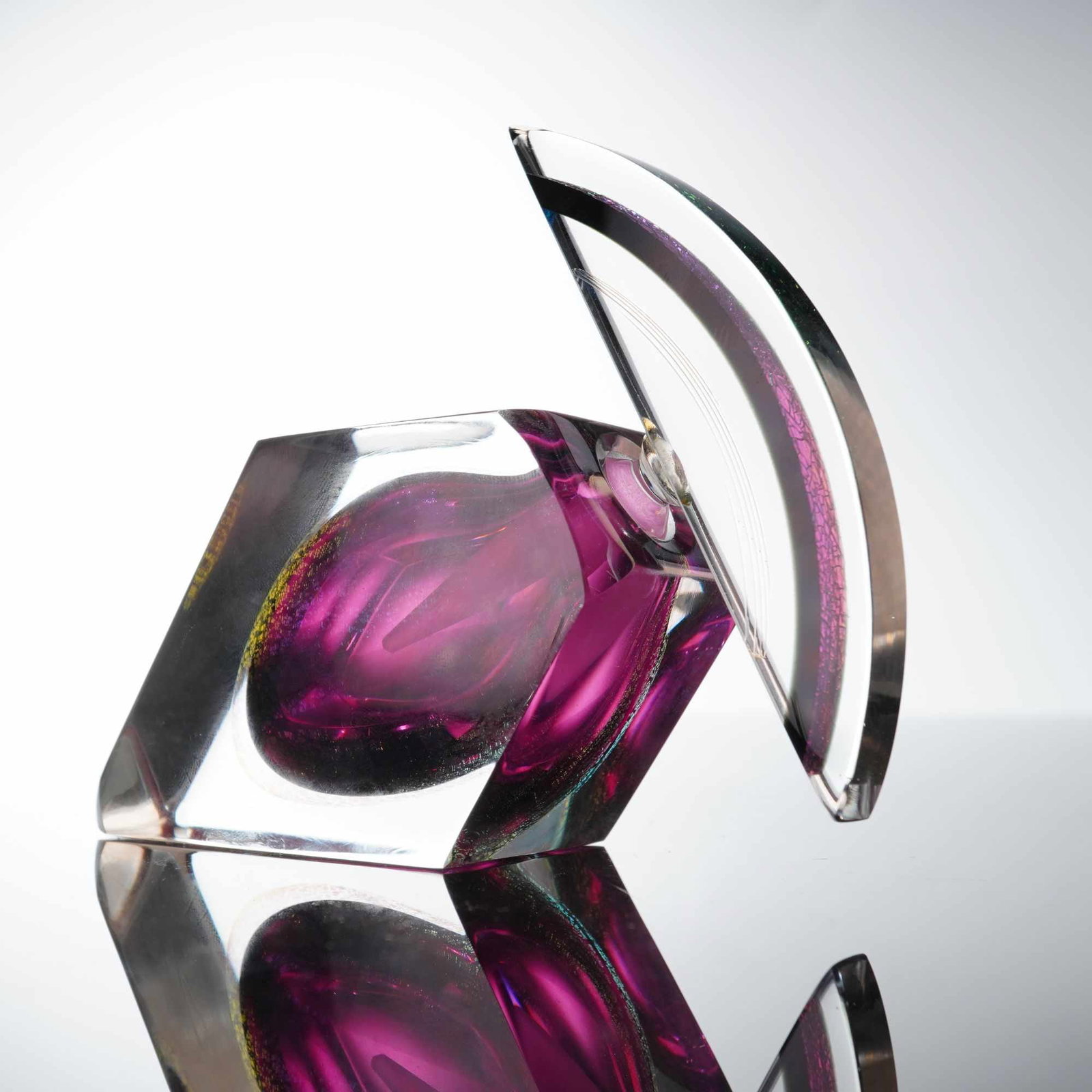 Correia Vivid Creations Art Glass Wedge Perfume Bottle and Stopper: This art glass perfume bottle and stopper is a creation by Correia Art Glass, part of the Vivid Creations series. The piece features a modern faceted wedge form constructed of heavy clear glass using 